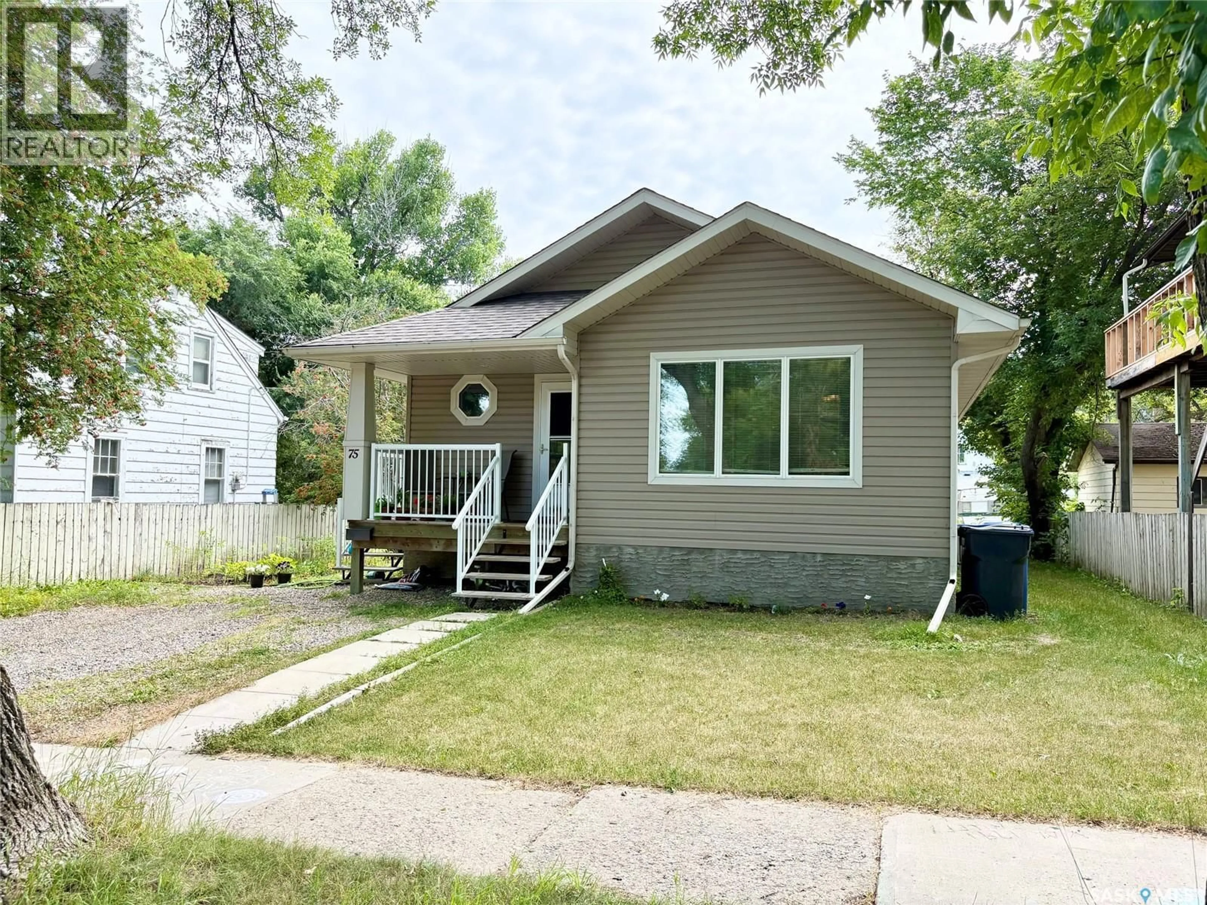 Home with vinyl exterior material, street for 75 AGRICULTURAL AVENUE, Yorkton Saskatchewan S3N1S2