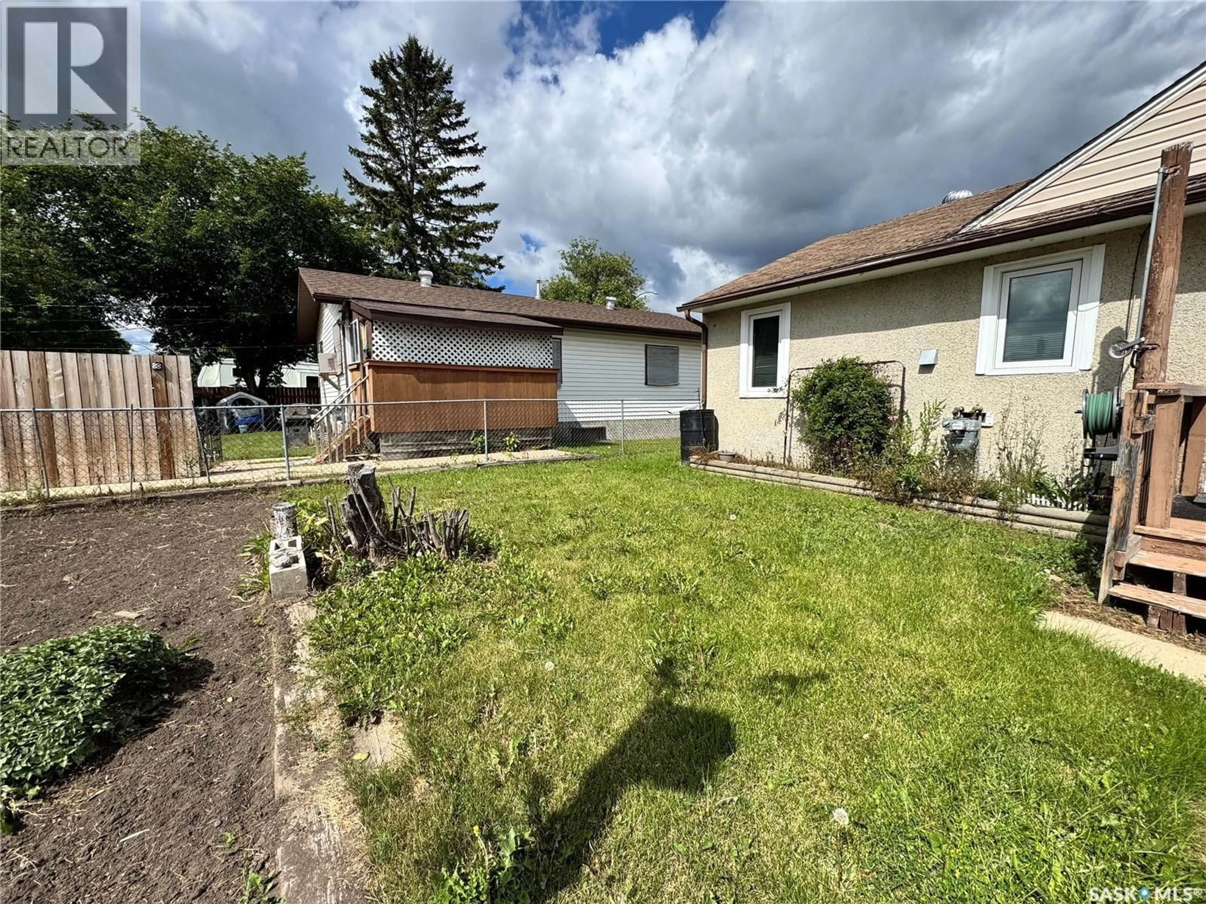 A pic from outside/outdoor area/front of a property/back of a property/a pic from drone, street for 1803 14TH STREET, Prince Albert Saskatchewan S6V3N9