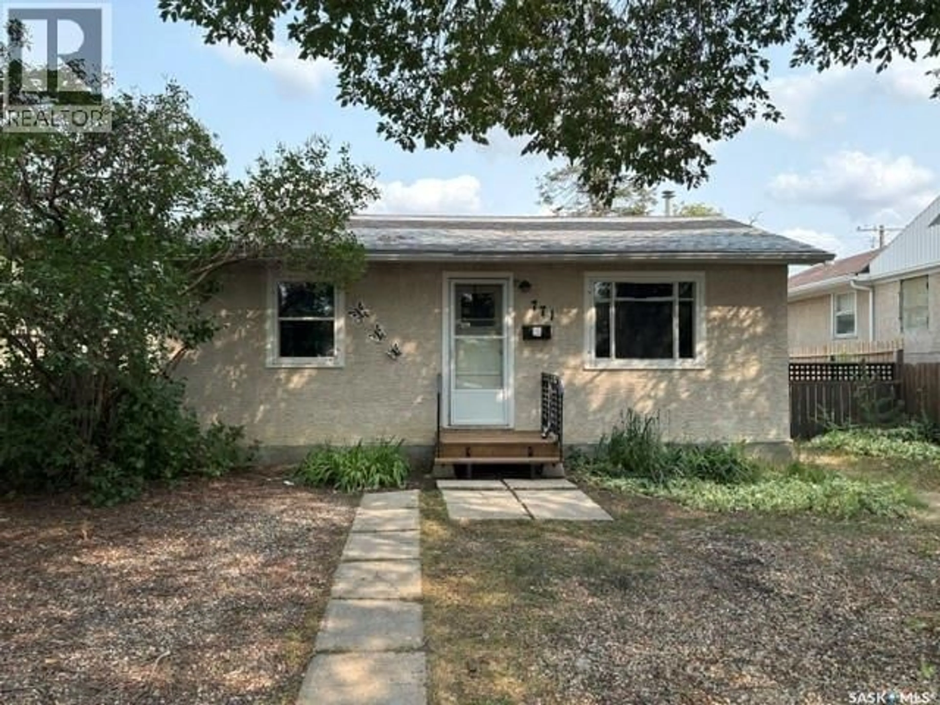 Home with vinyl exterior material, street for 771 PRINCESS STREET, Regina Saskatchewan S4R5T1