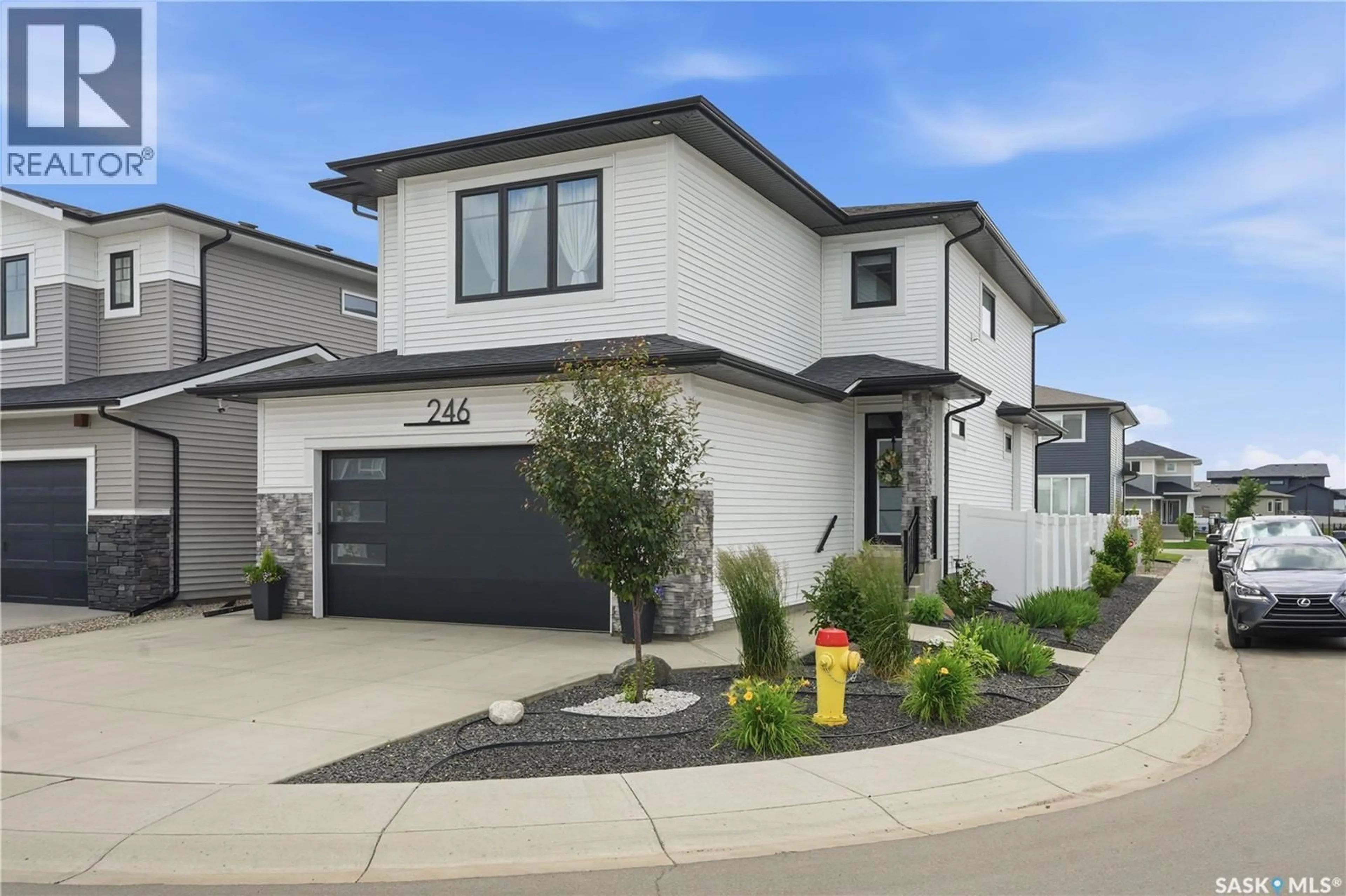 Home with brick exterior material, street for 246 PRASAD MANOR, Saskatoon Saskatchewan S7V1L4