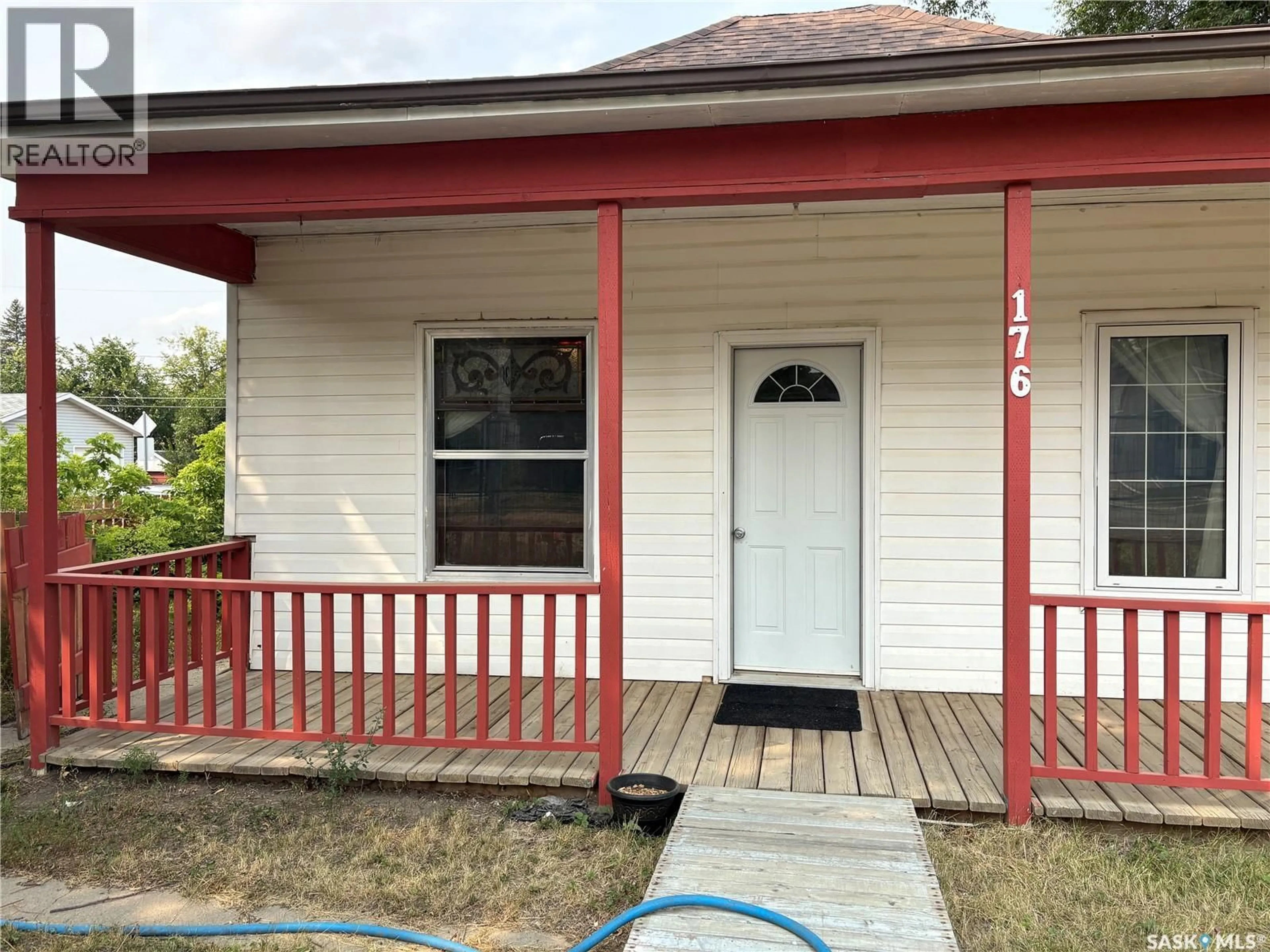Home with vinyl exterior material, street for 176 COTEAU STREET, Moose Jaw Saskatchewan S6H5C5