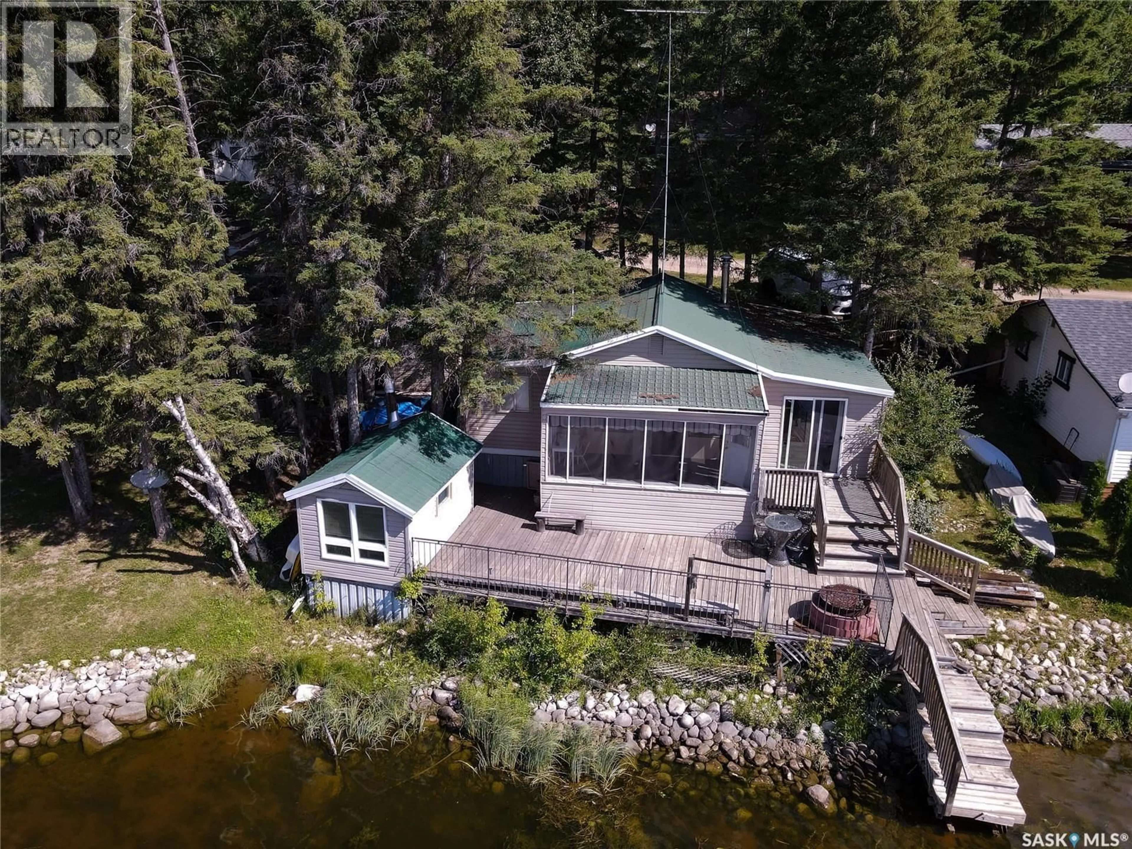 A pic from outside/outdoor area/front of a property/back of a property/a pic from drone, water/lake/river/ocean view for STURGEON LAKEFRONT CABIN, Sturgeon Lake Saskatchewan S0J2E0