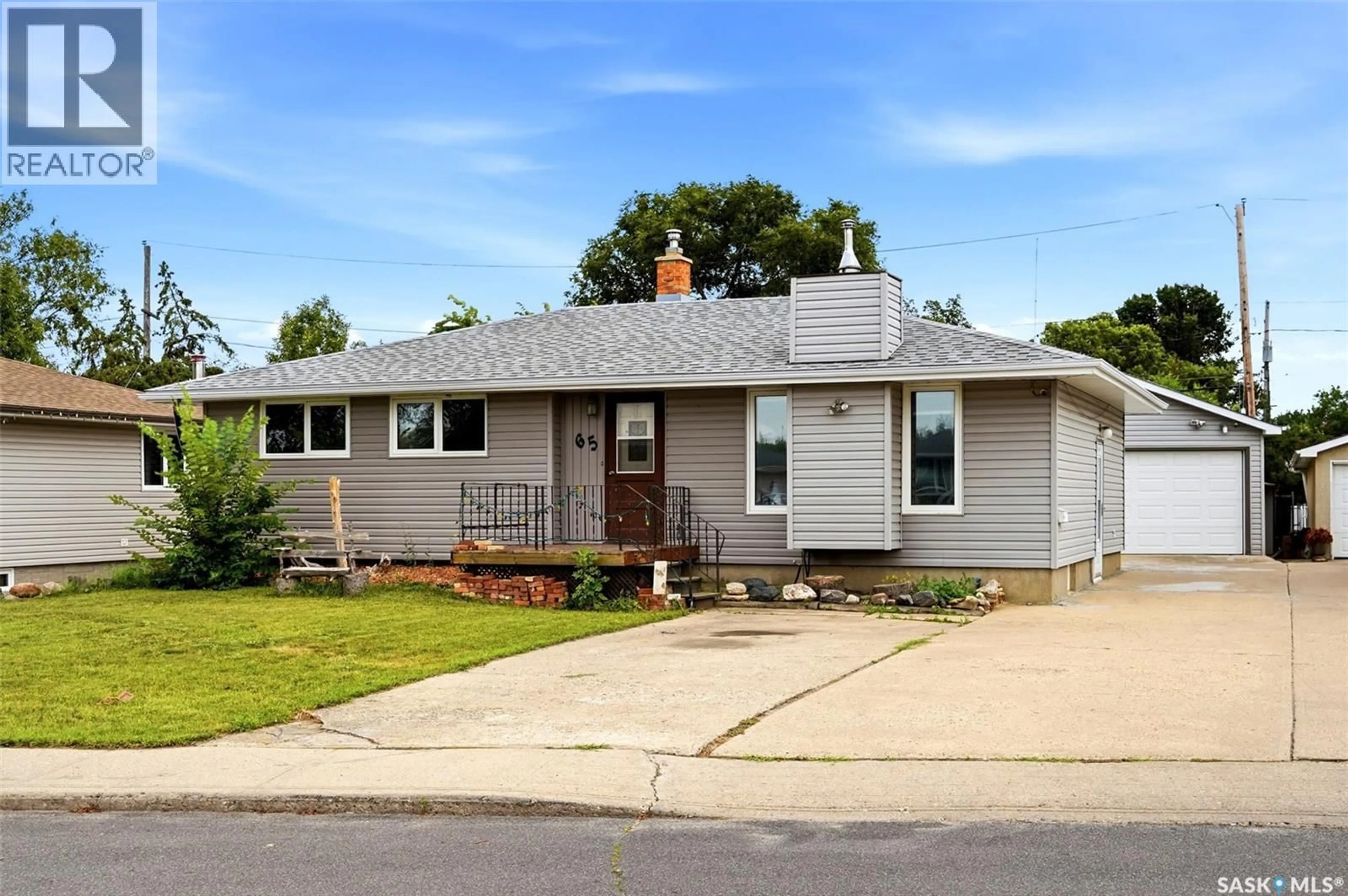 Home with vinyl exterior material, street for 65 MCCAUL CRESCENT, Regina Saskatchewan S4R3X3