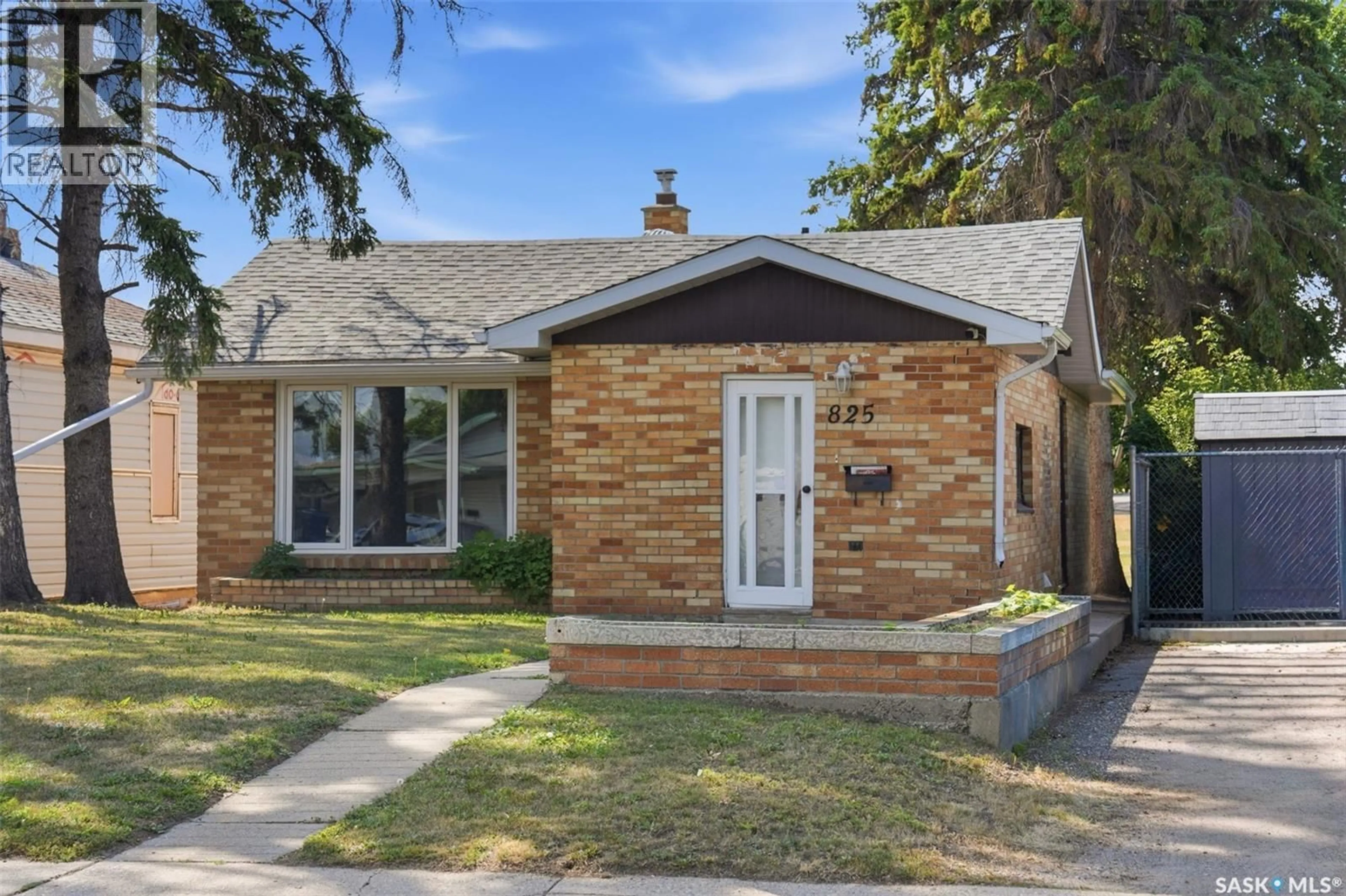 Home with brick exterior material, street for 825 L AVENUE, Saskatoon Saskatchewan S7L2R3