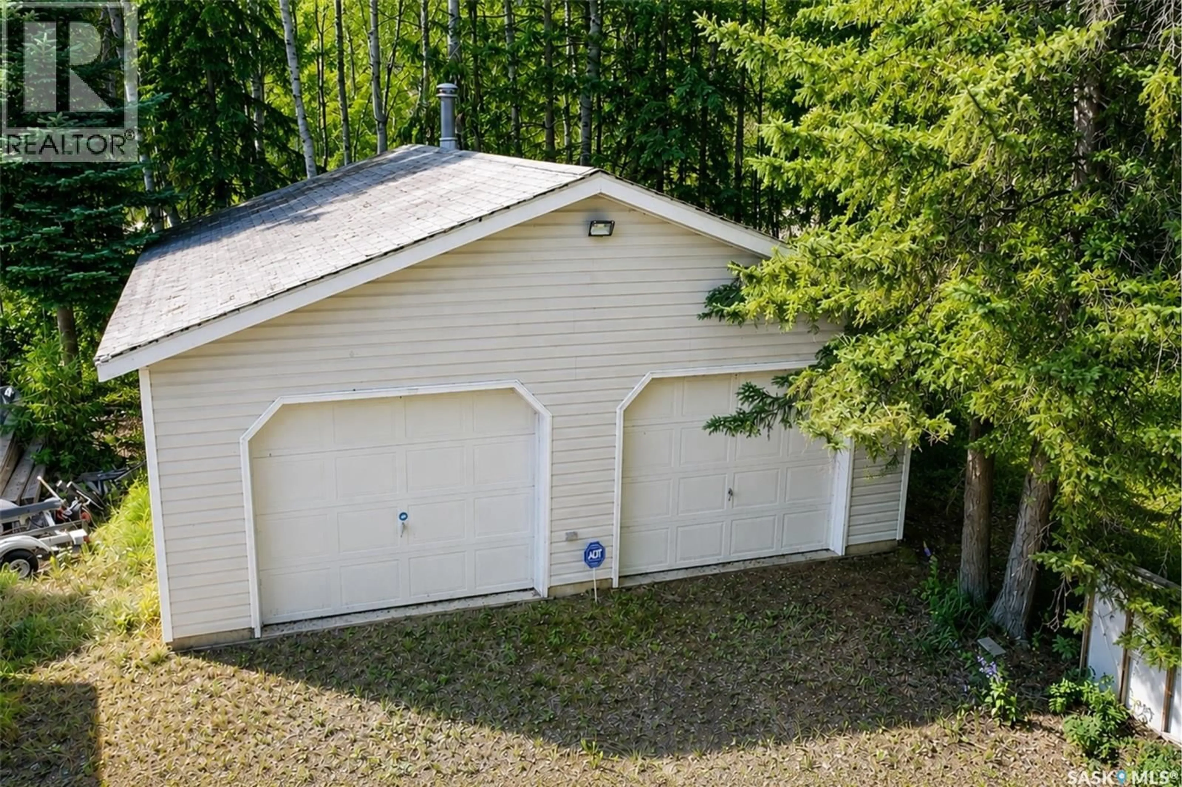 A pic from outside/outdoor area/front of a property/back of a property/a pic from drone, unknown for 303 CHRISTEL CRESCENT, Lac des Îles Saskatchewan S0M1A0