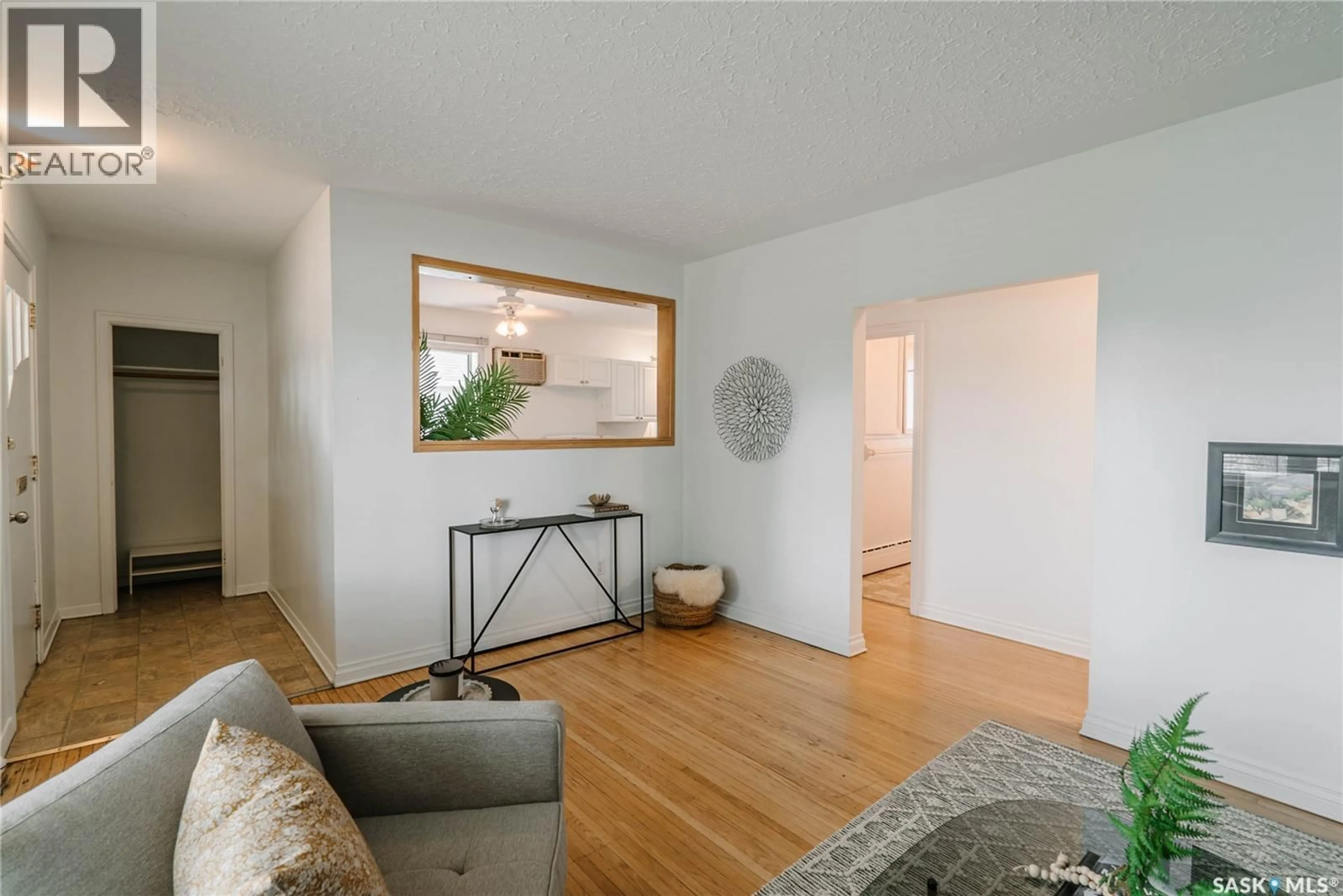 Living room with furniture, wood/laminate floor for 1012 2ND STREET E, Saskatoon Saskatchewan S7H1R3