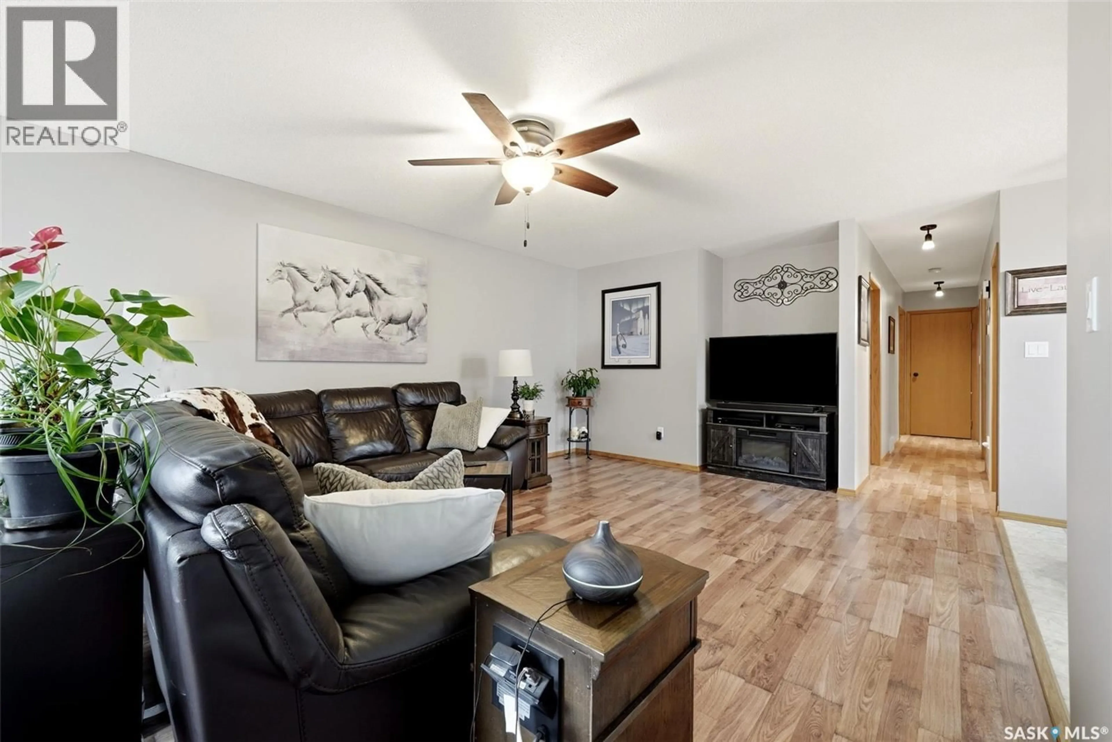 Living room with furniture, wood/laminate floor for 104 FINDLAY STREET, Cupar Saskatchewan S0G0Y0