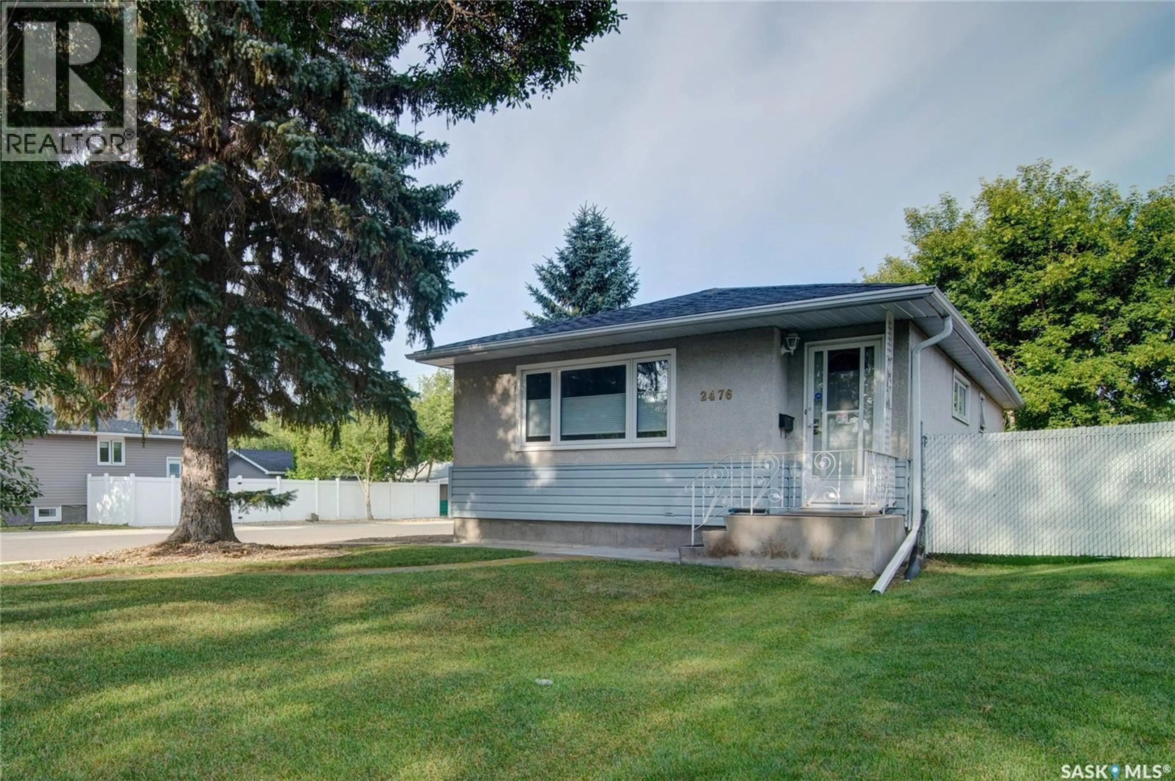 Home with vinyl exterior material, street for 2476 MCARA STREET, Regina Saskatchewan S4N2W5