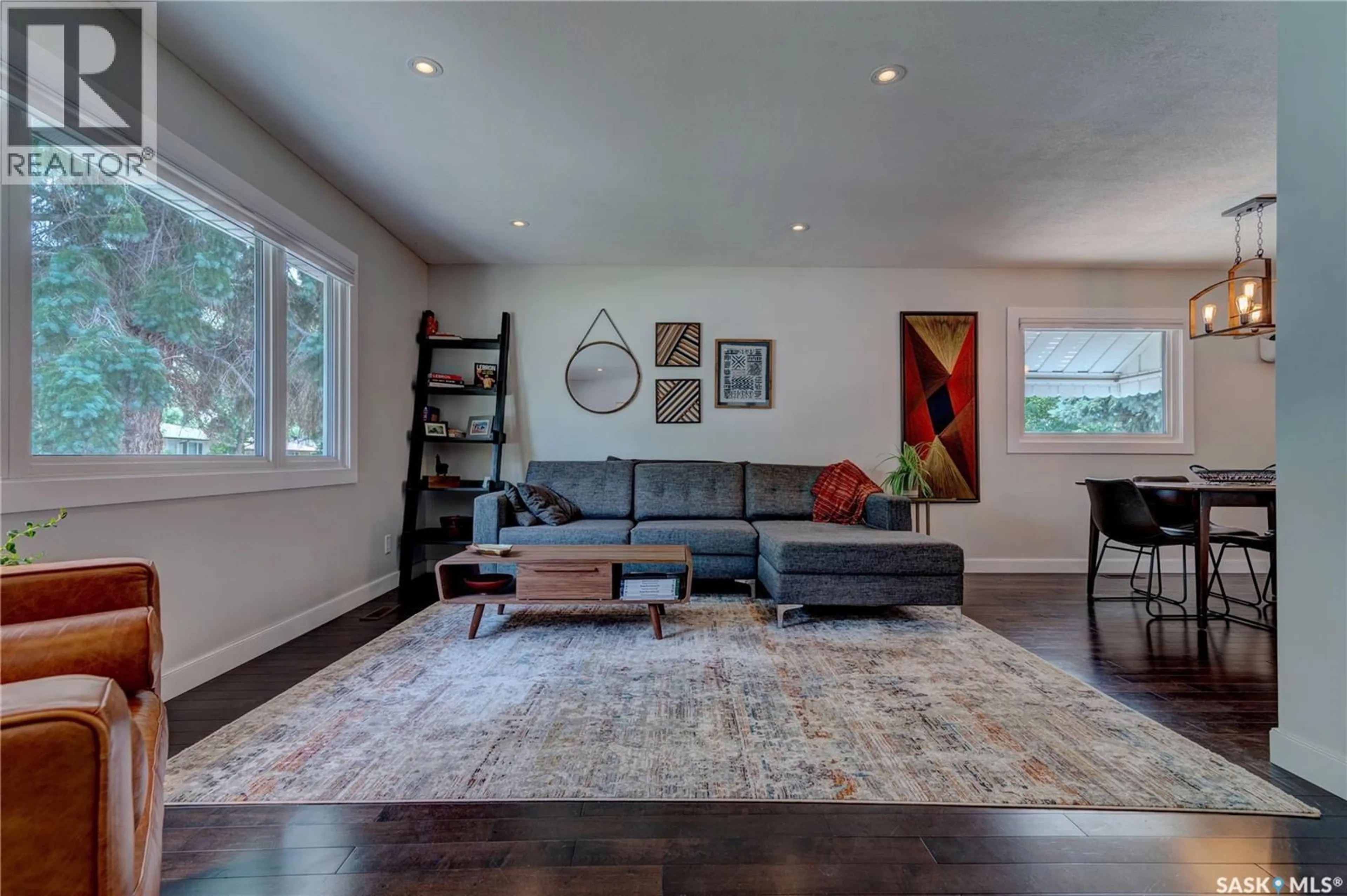 Living room with furniture, wood/laminate floor for 2476 MCARA STREET, Regina Saskatchewan S4N2W5