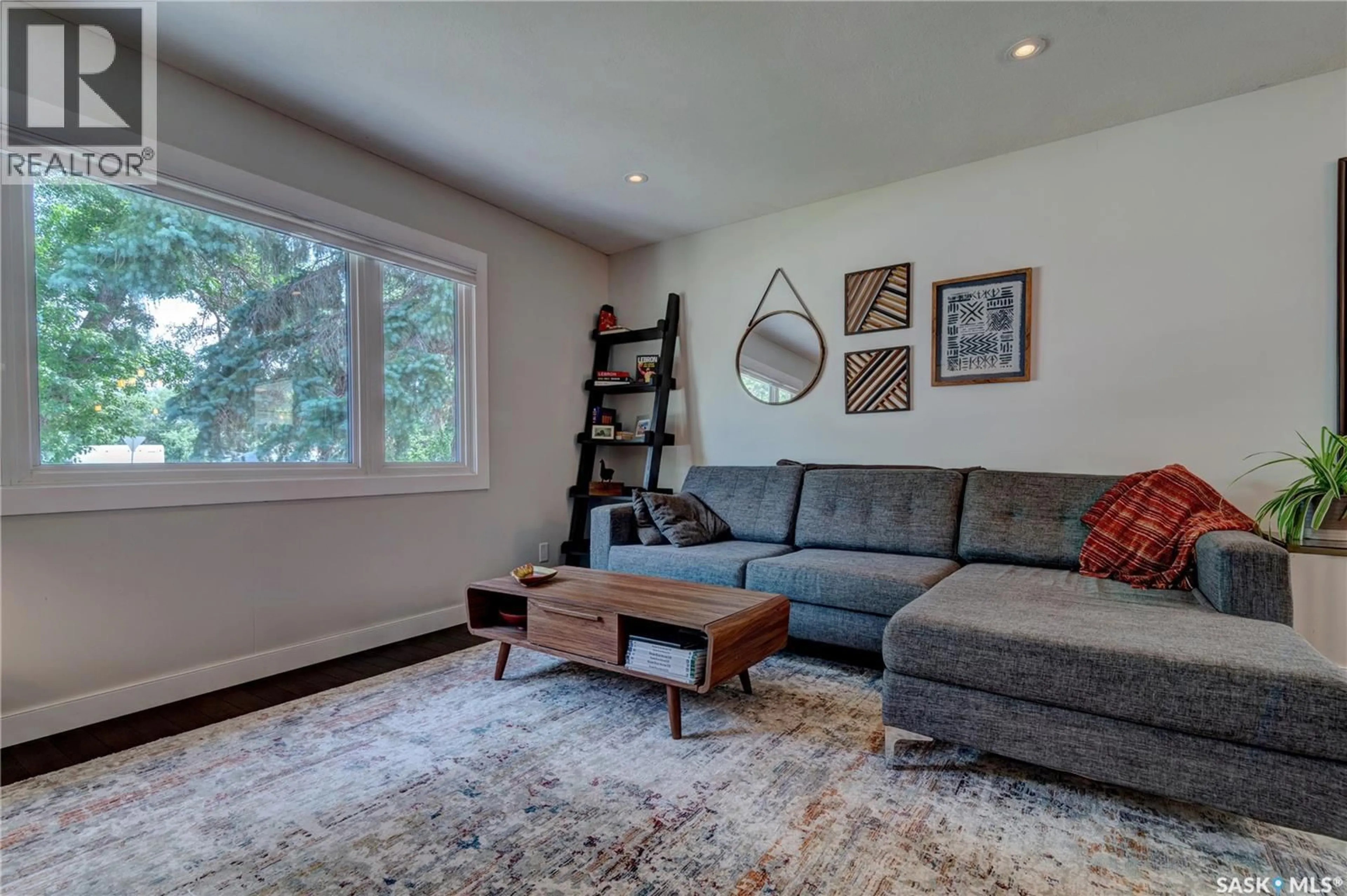 Living room with furniture, wood/laminate floor for 2476 MCARA STREET, Regina Saskatchewan S4N2W5