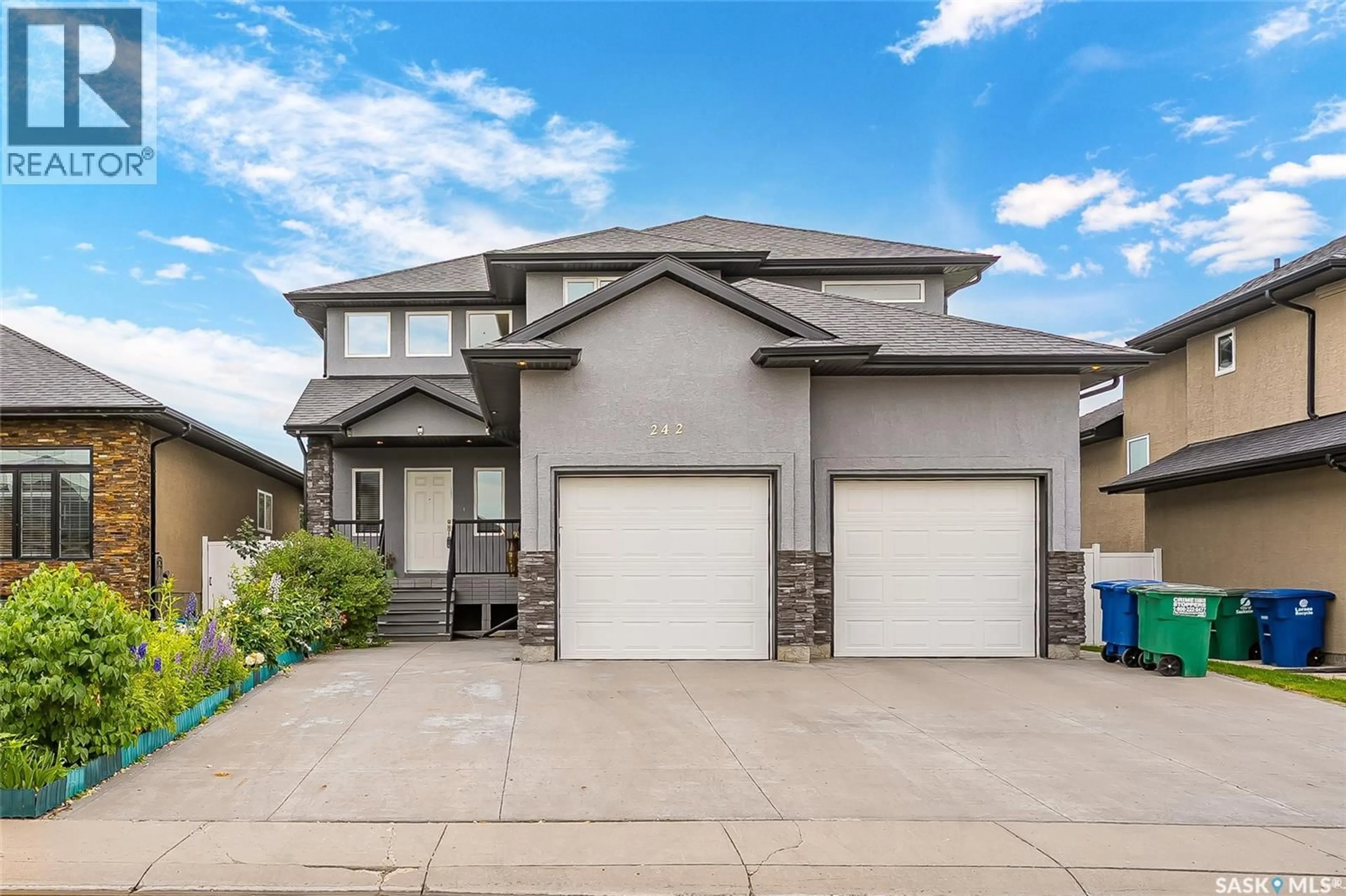 Home with vinyl exterior material, street for 242 POHORECKY STREET, Saskatoon Saskatchewan S7W0J3