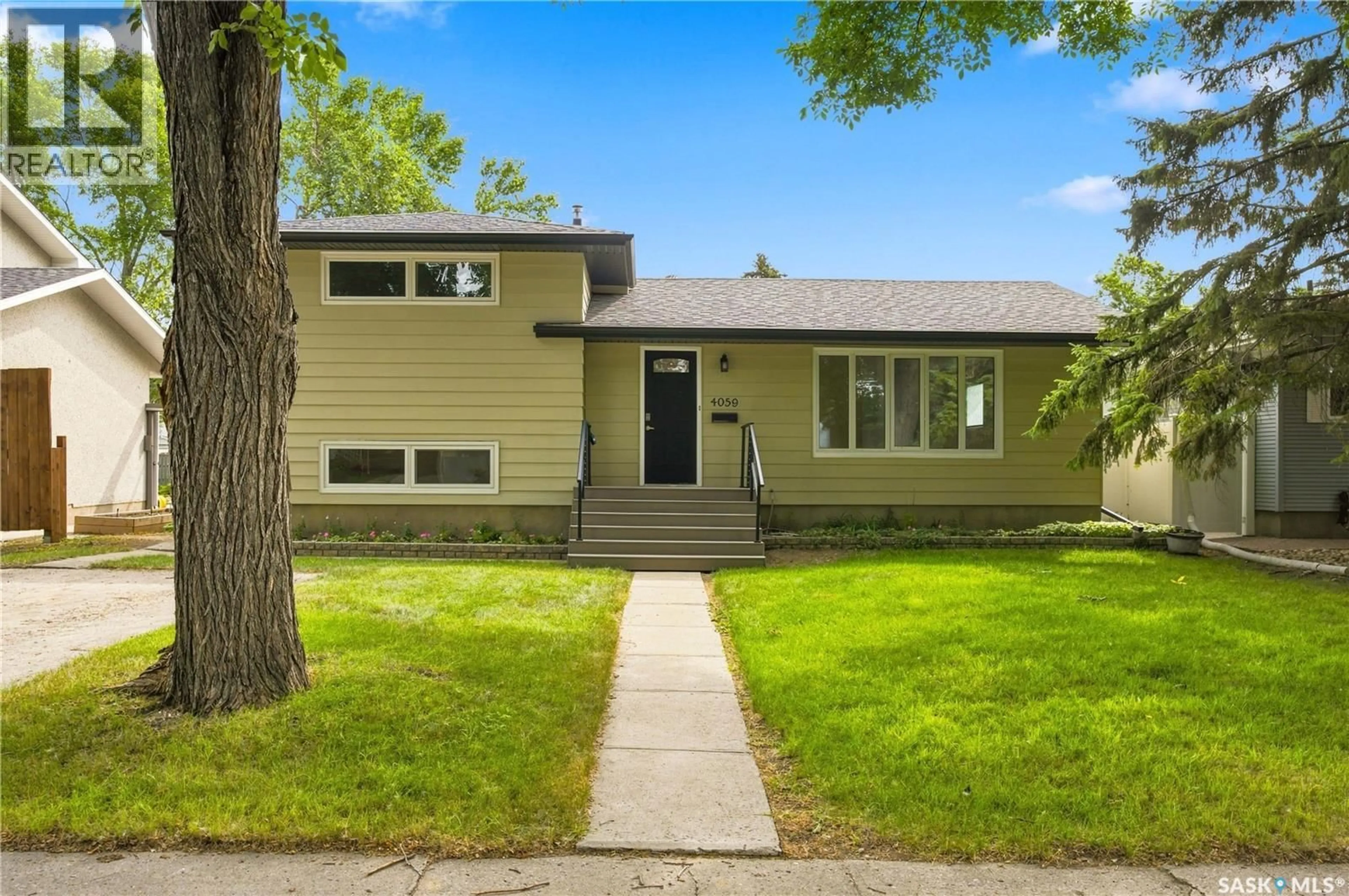 Home with vinyl exterior material, street for 4059 ELPHINSTONE STREET, Regina Saskatchewan S4S3L1
