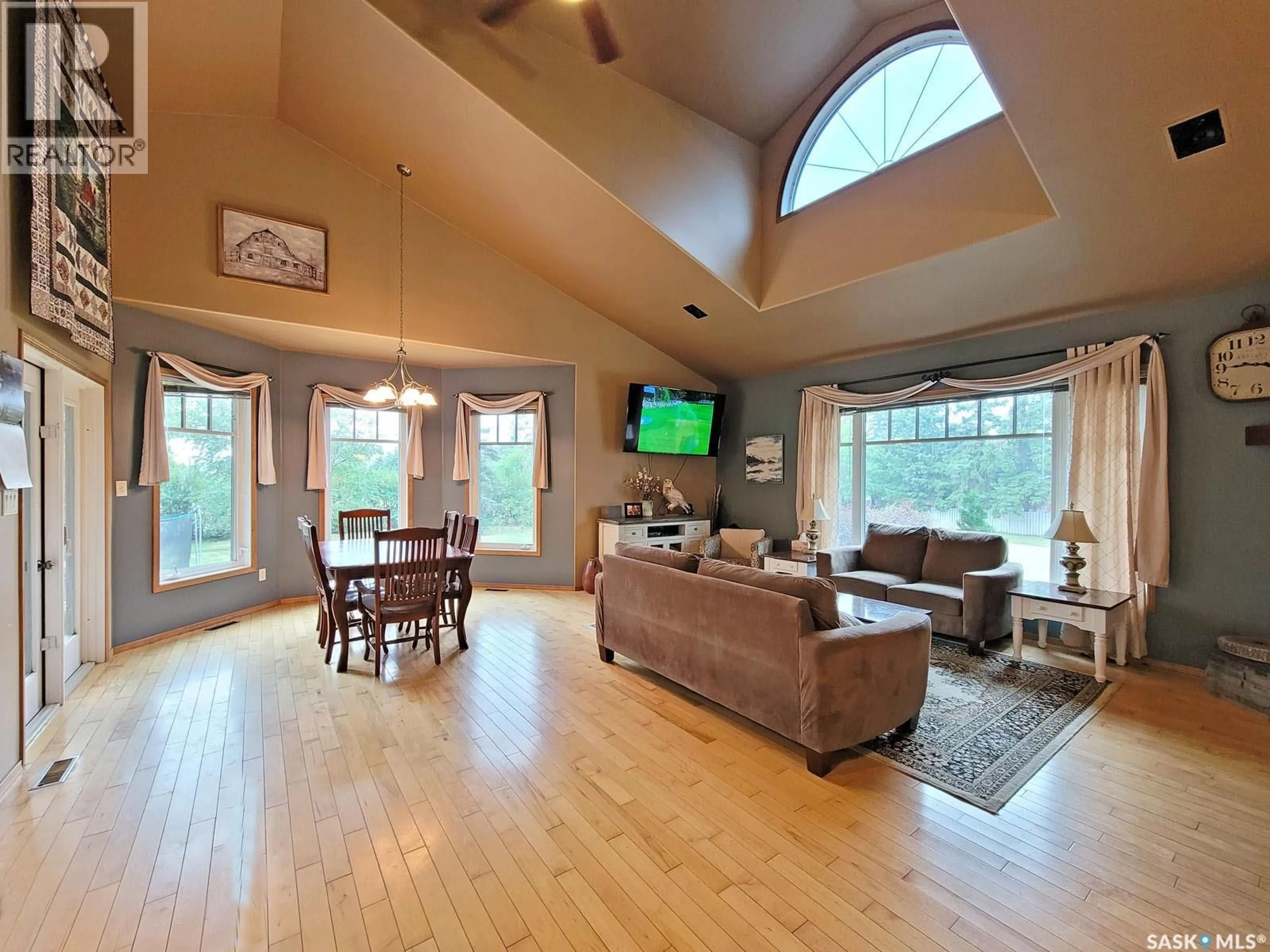 Living room with furniture, wood/laminate floor for 717 3RD AVENUE, Meadow Lake Saskatchewan S9X1A5