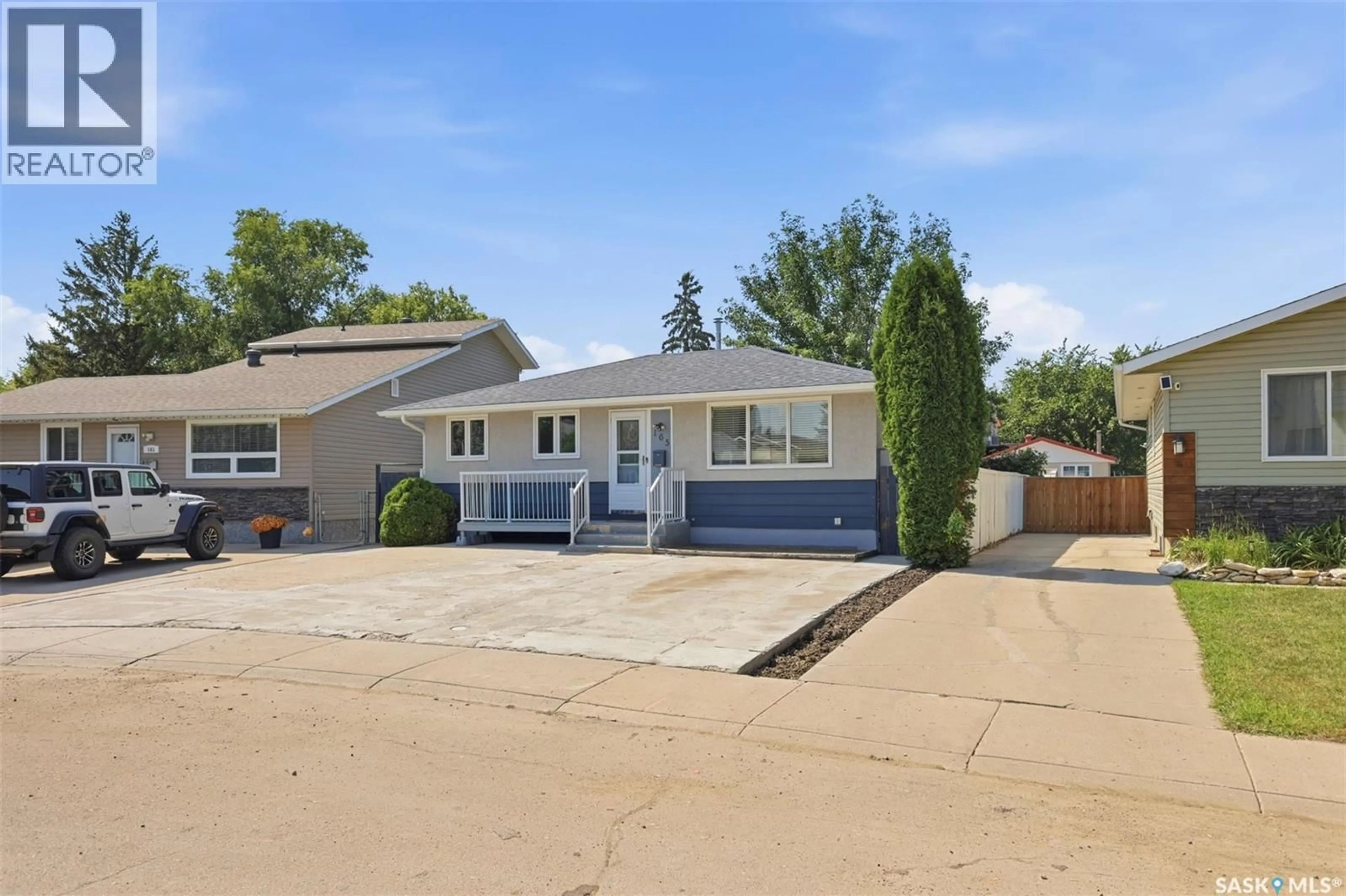 Home with vinyl exterior material, street for 165 ACADIA COURT, Saskatoon Saskatchewan S7H4C4