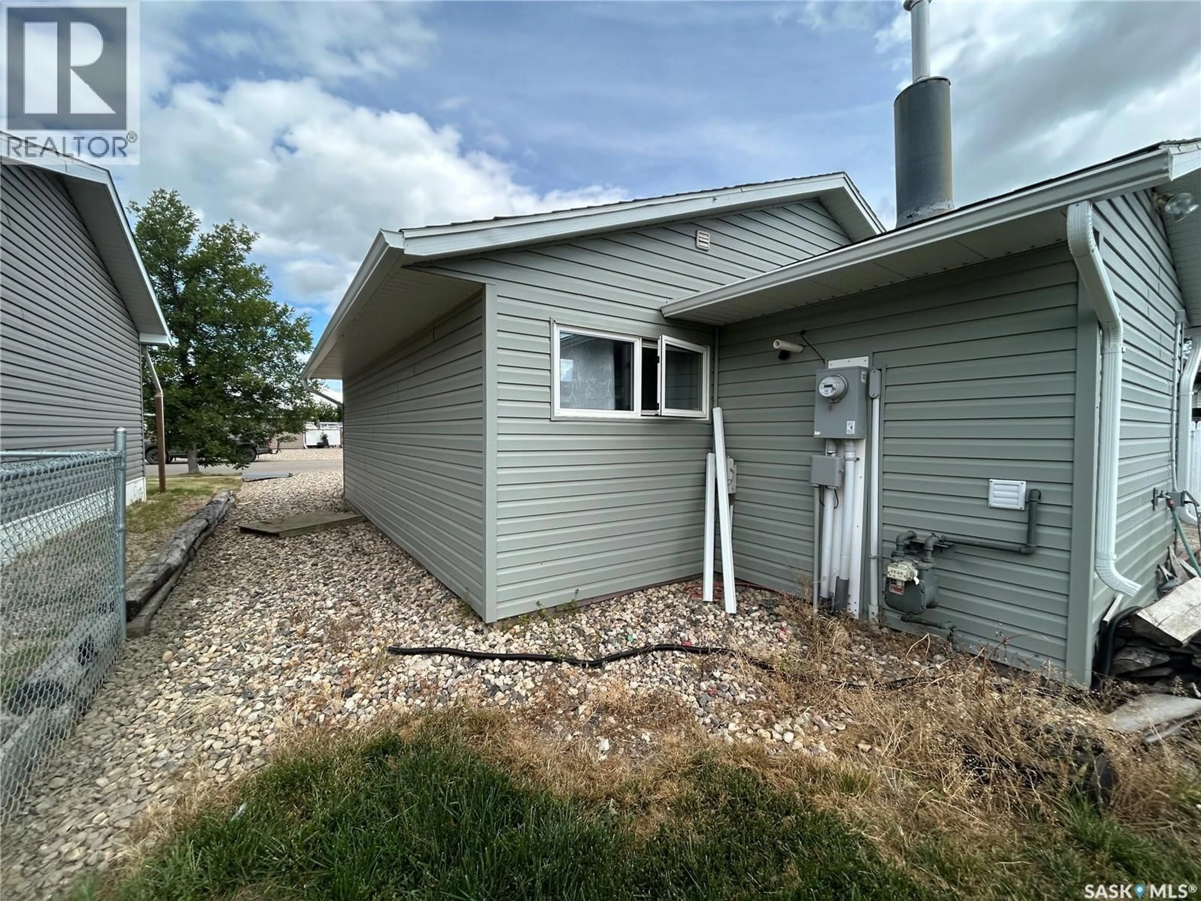 Home with vinyl exterior material, street for 714 101ST AVENUE, Tisdale Saskatchewan S0E1T0