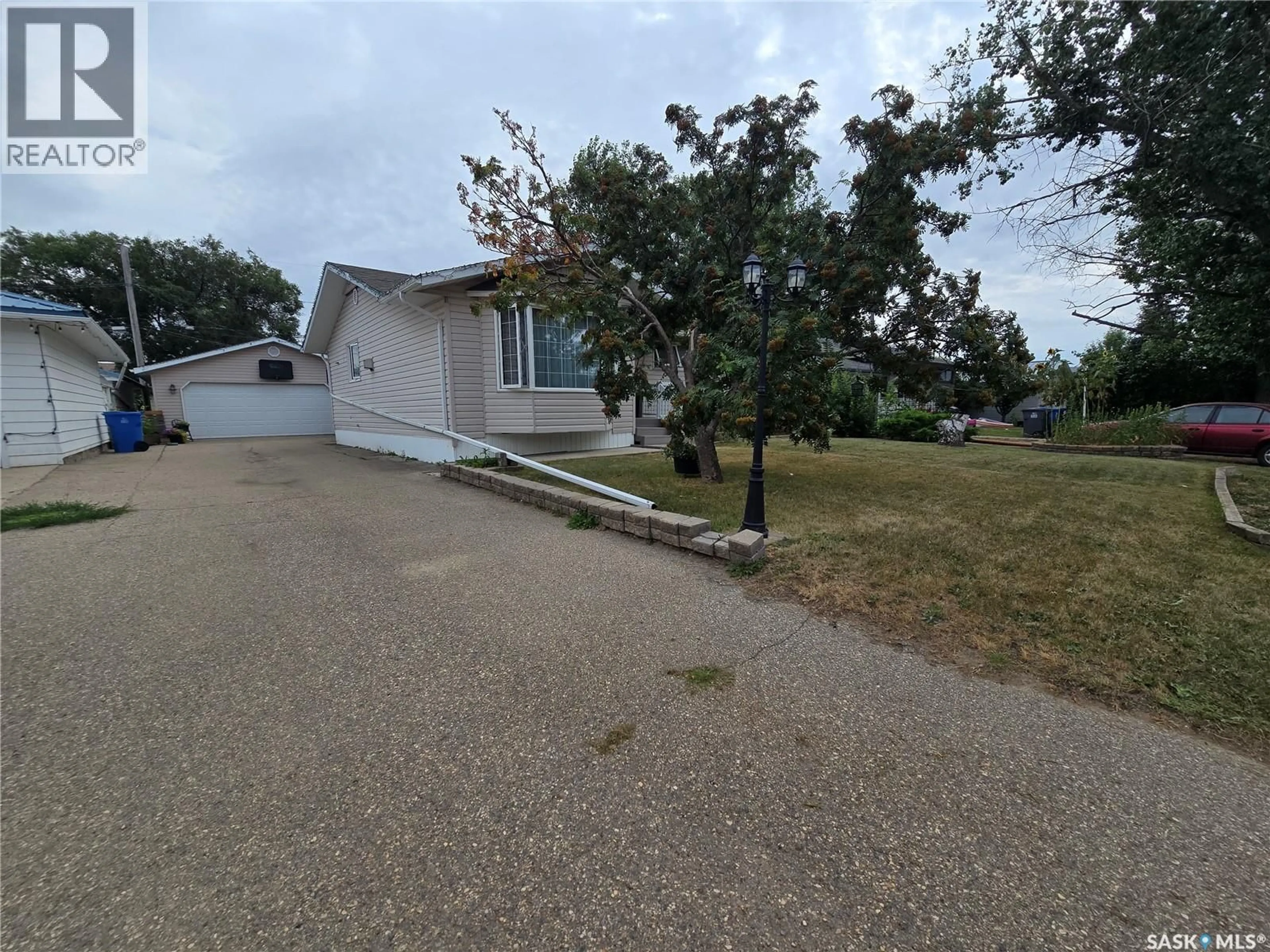 A pic from outside/outdoor area/front of a property/back of a property/a pic from drone, street for 311 EISENHOWER STREET, Midale Saskatchewan S4H1S0