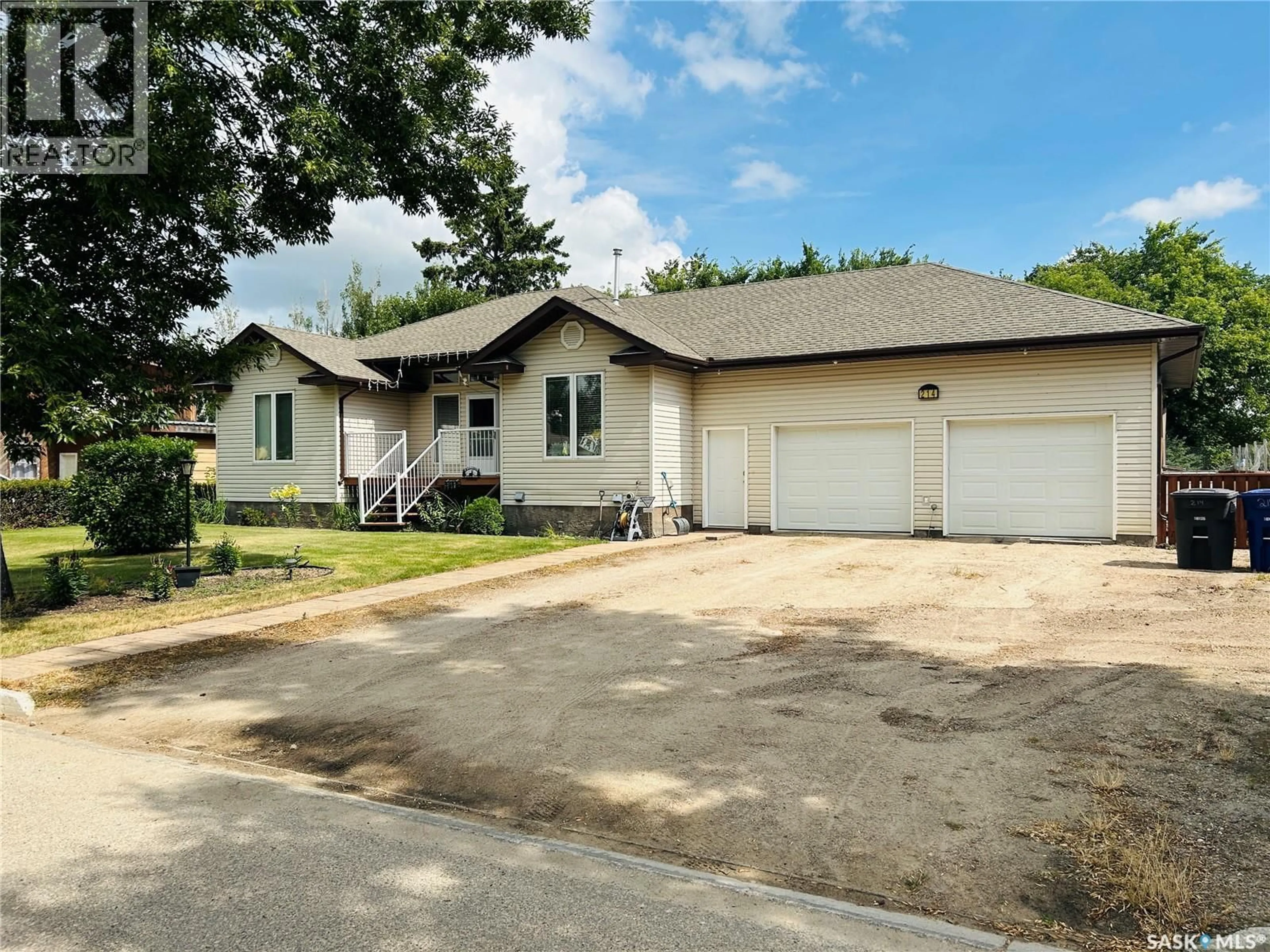 Home with vinyl exterior material, street for 214 3RD STREET, Watson Saskatchewan S0K4V0