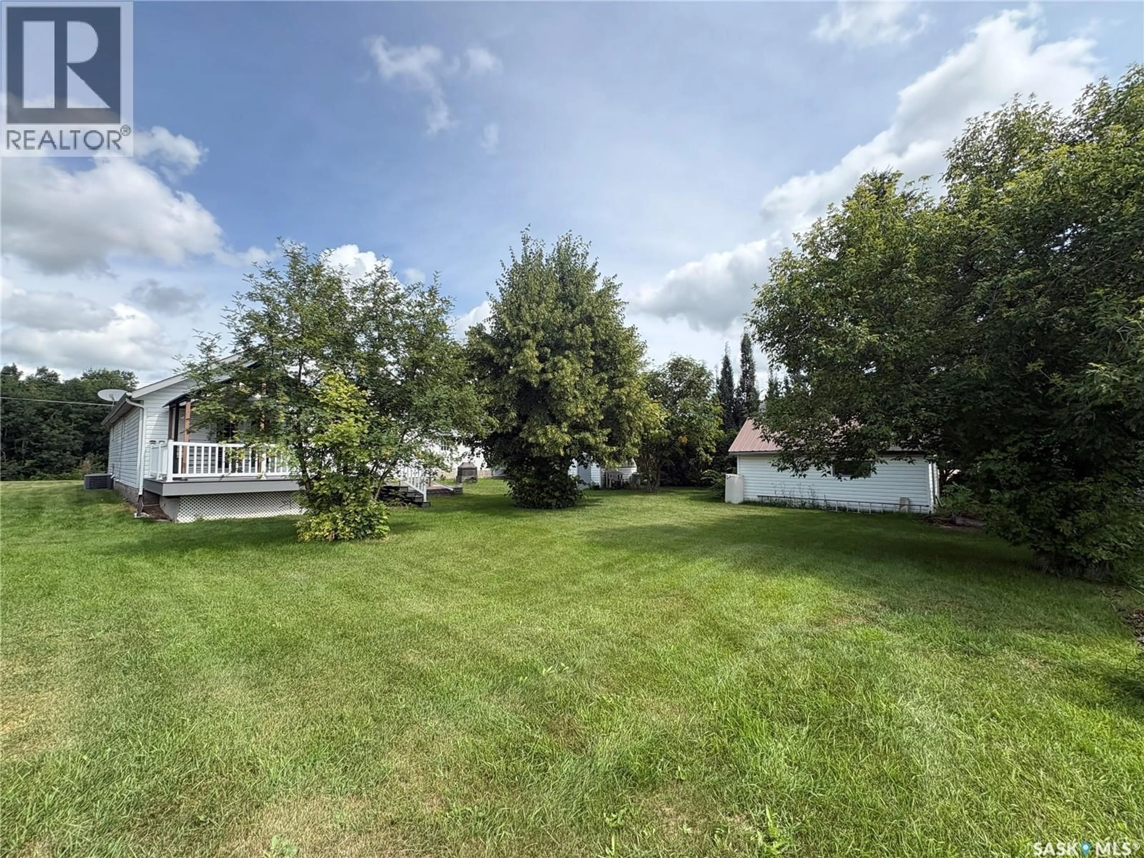 A pic from outside/outdoor area/front of a property/back of a property/a pic from drone, water/lake/river/ocean view for E - 511 ROAD AVENUE, Langenburg Saskatchewan S0A2A0