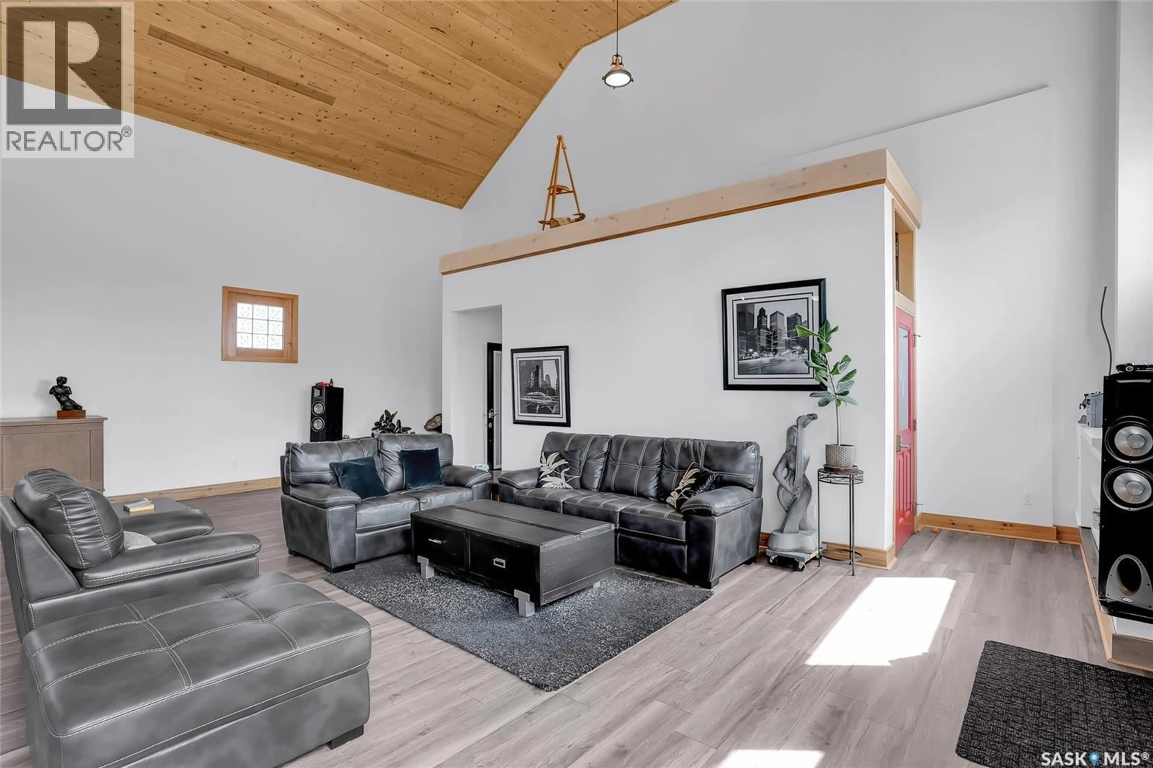 Living room with furniture, wood/laminate floor for 310 F AVENUE, Saskatoon Saskatchewan S7M1T2