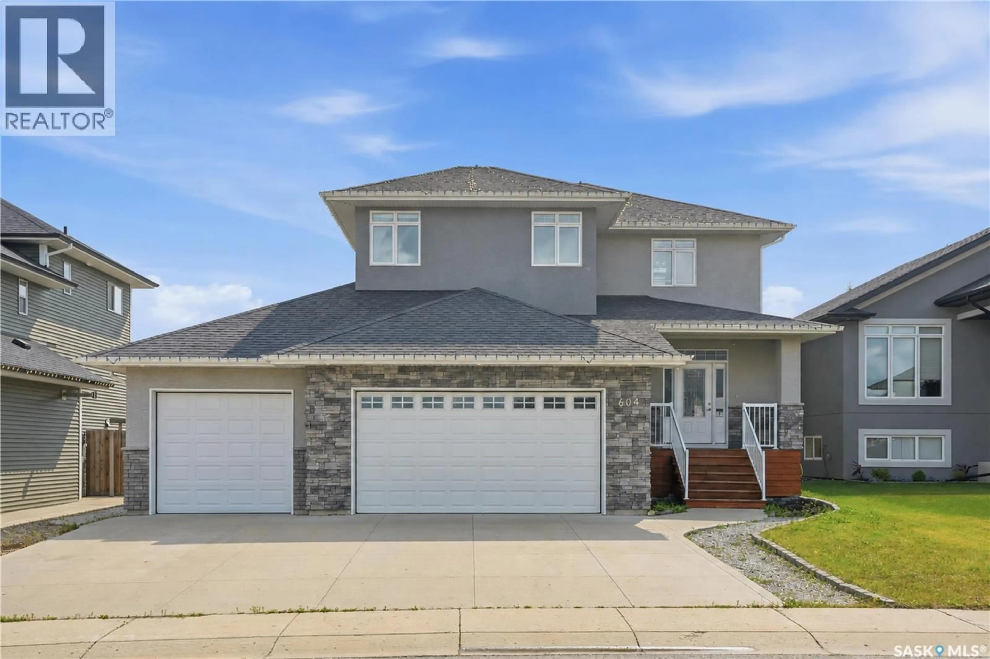 Home with vinyl exterior material, street for 604 SILVER BIRCH LANE, Warman Saskatchewan S0K4S2