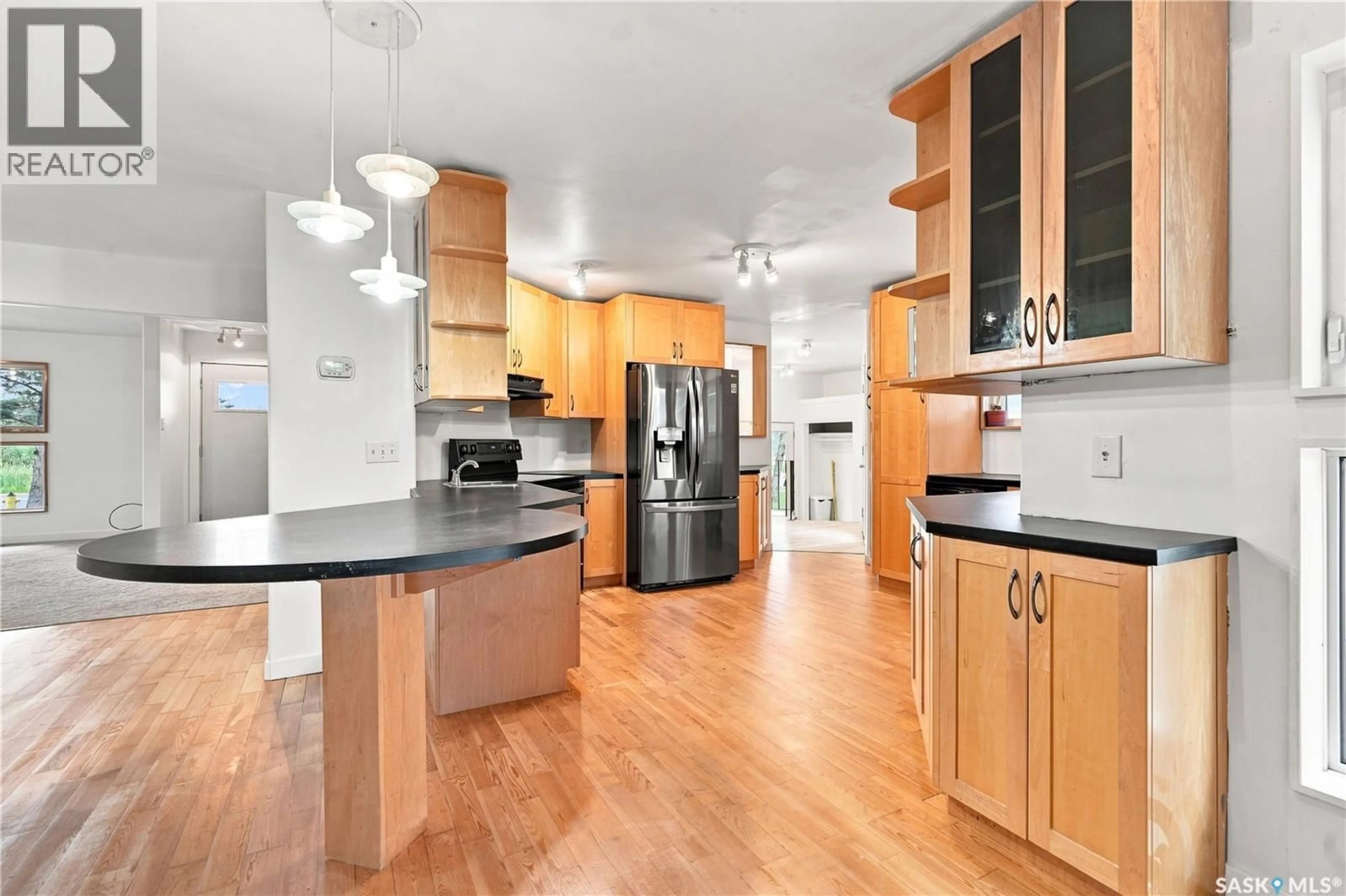 Open concept kitchen, wood/laminate floor for 3445 11TH STREET, Saskatoon Saskatchewan S7M1K4