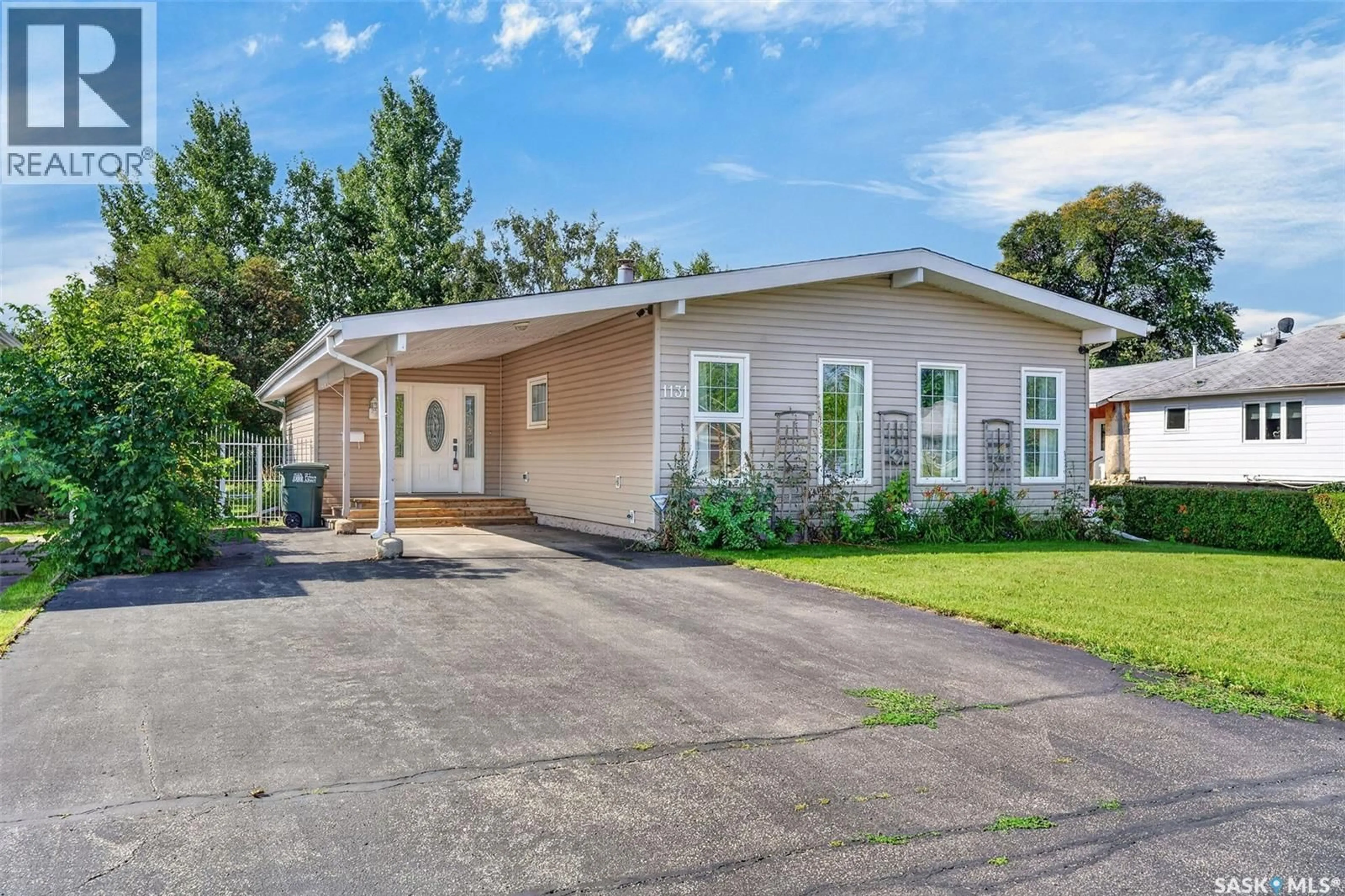 Home with vinyl exterior material, street for 1131 6TH STREET, Prince Albert Saskatchewan S6V0P8