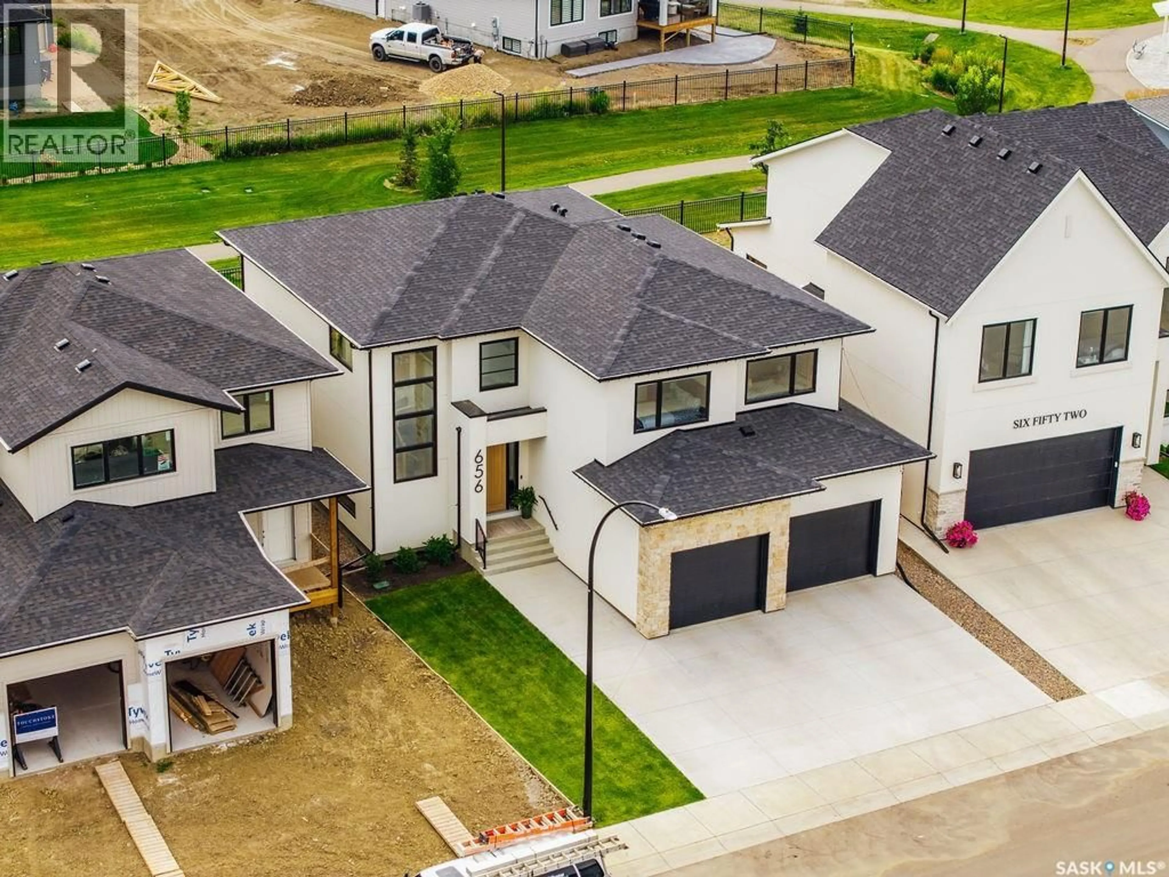 A pic from outside/outdoor area/front of a property/back of a property/a pic from drone, street for 656 PEPPER BEND, Saskatoon Saskatchewan S7V1T3