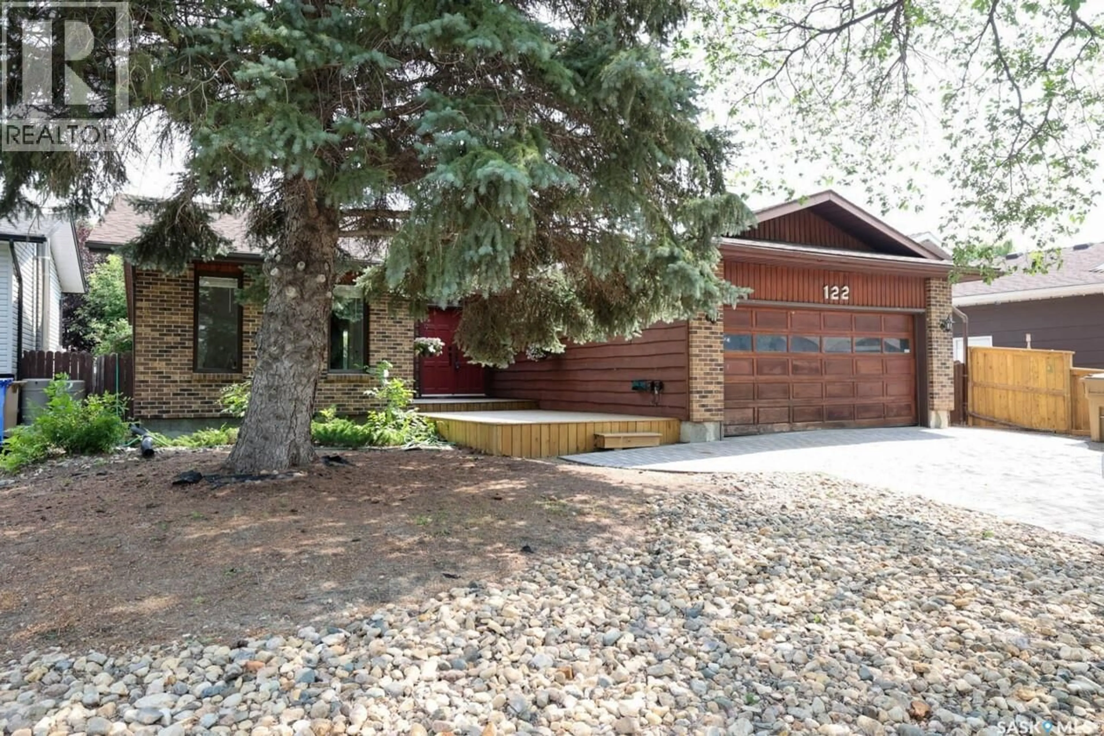 Home with brick exterior material, street for 122 EDENWOLD CRESCENT, Regina Saskatchewan S4R8A3