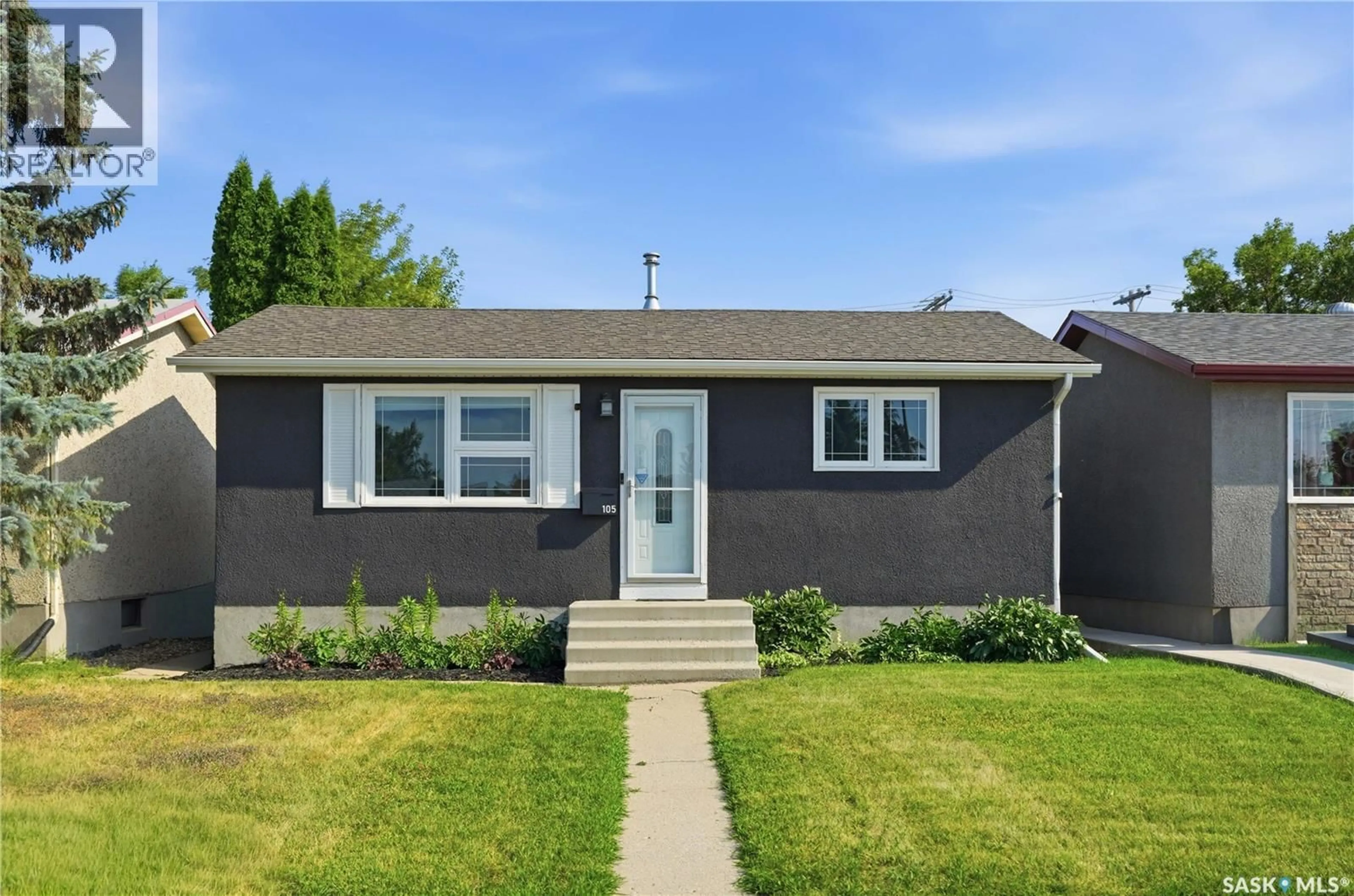 Home with vinyl exterior material, street for 105 GRANT STREET, Saskatoon Saskatchewan S7N2A2