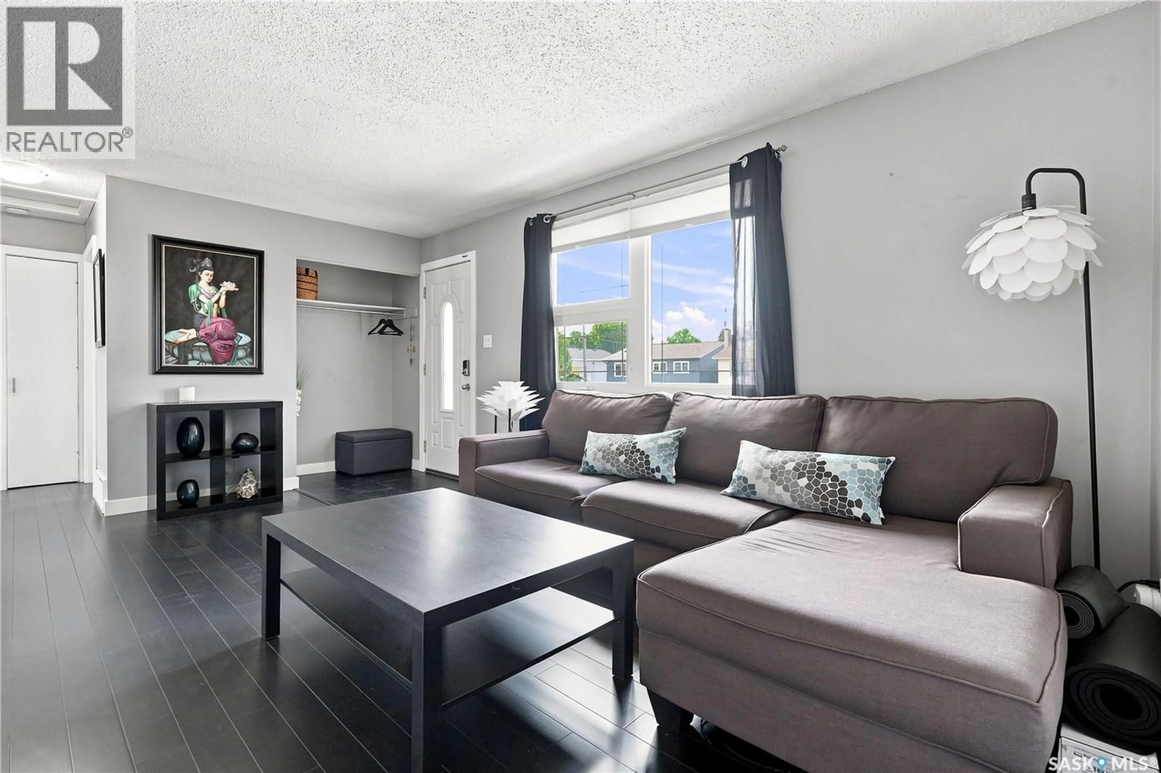 Living room with furniture, wood/laminate floor for 105 GRANT STREET, Saskatoon Saskatchewan S7N2A2