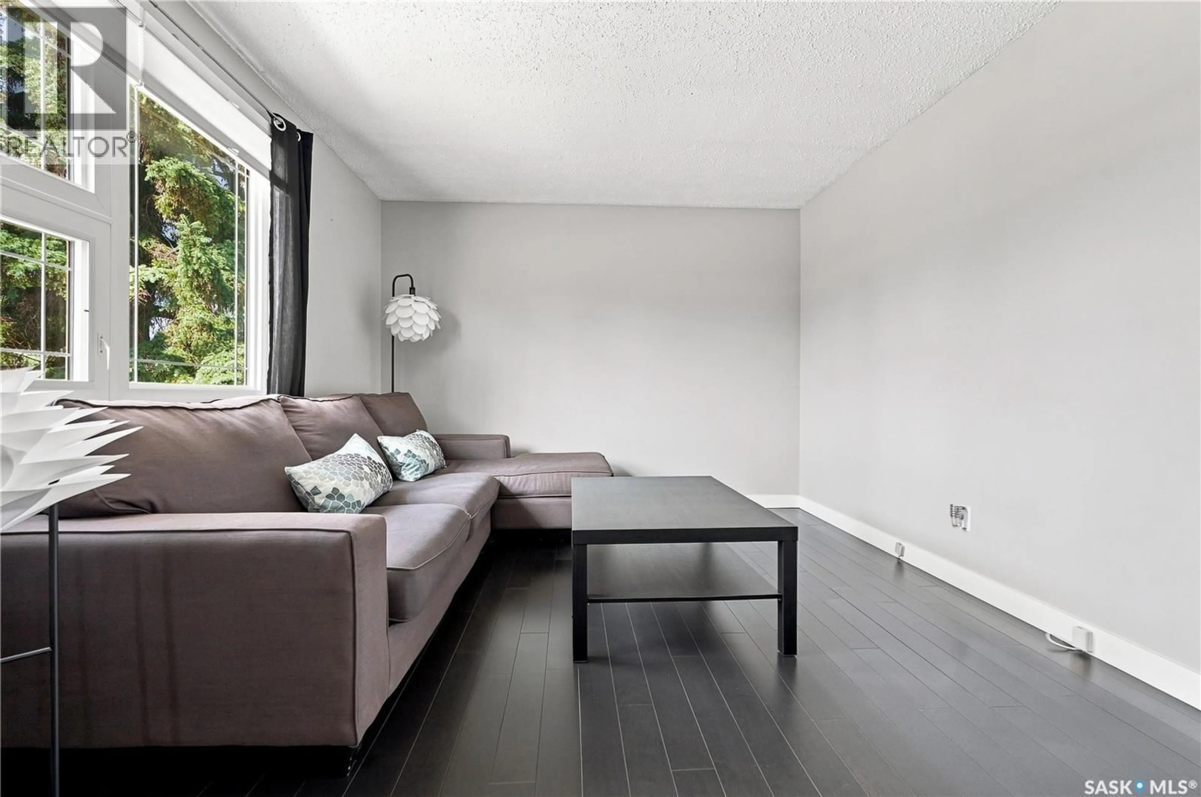 Living room with furniture, wood/laminate floor for 105 GRANT STREET, Saskatoon Saskatchewan S7N2A2