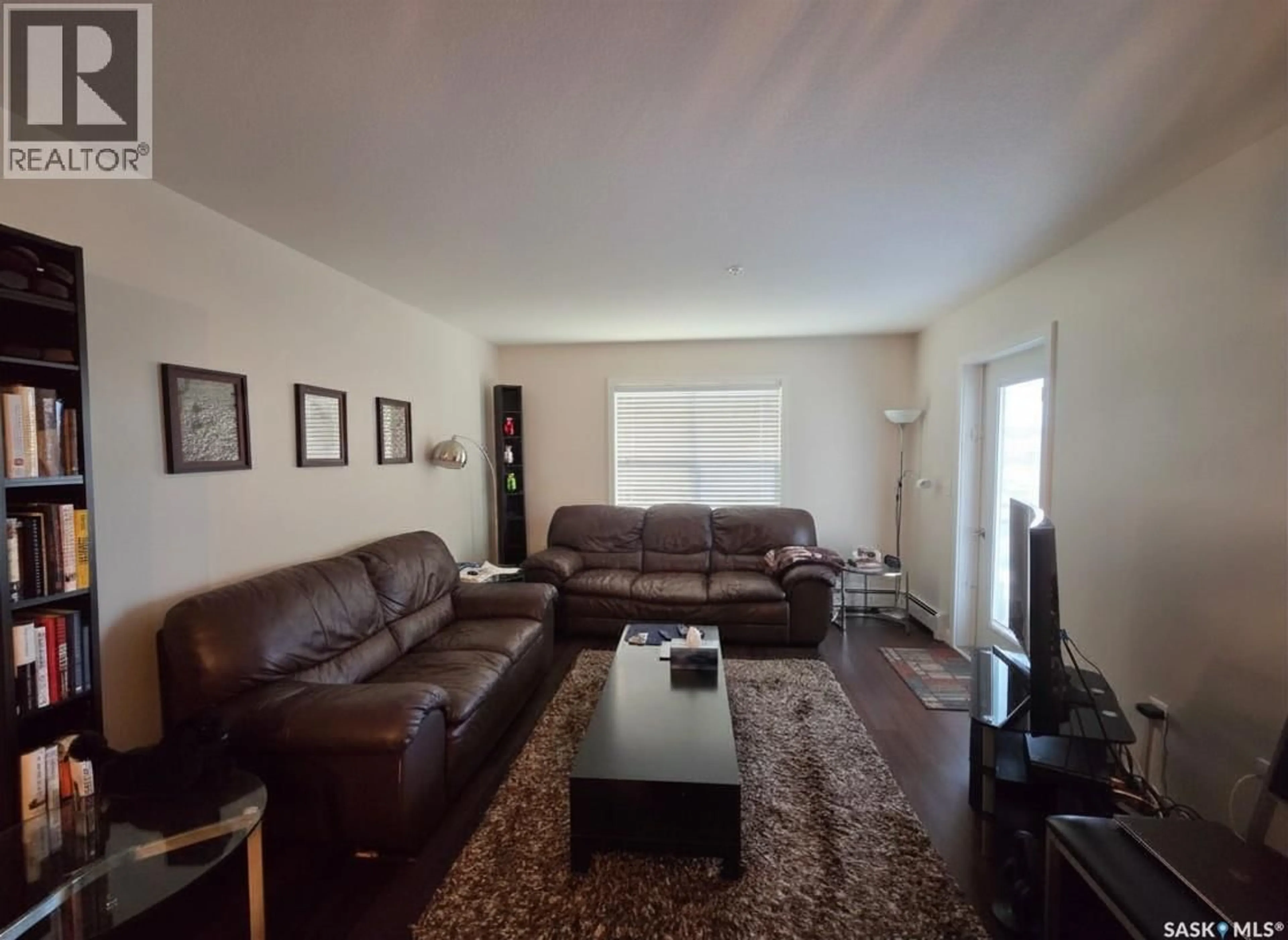 Living room with furniture, unknown for 211 - 216 LEDINGHAM STREET, Saskatoon Saskatchewan S7V0C5