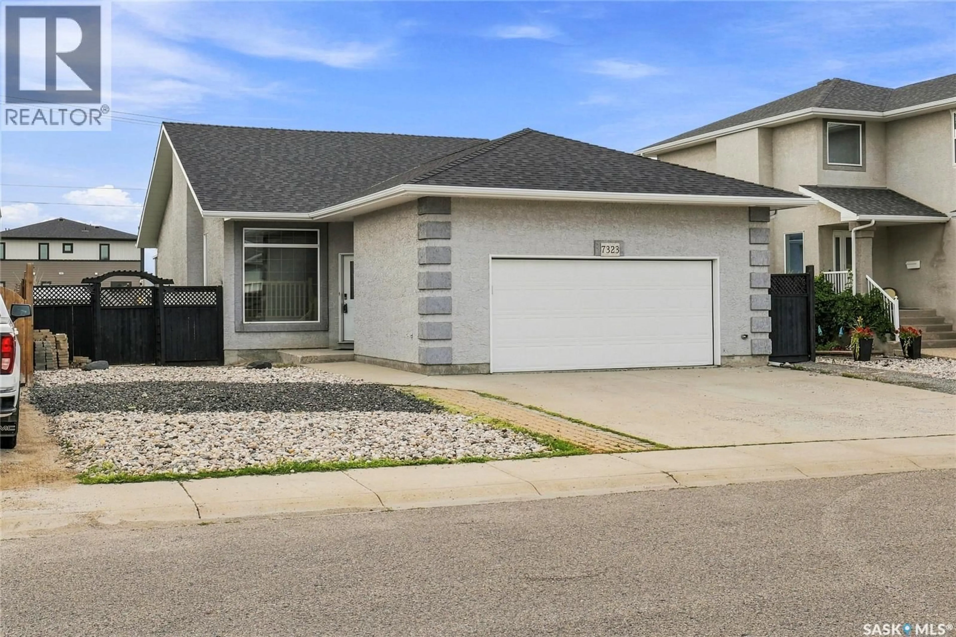 Home with vinyl exterior material, street for 7323 MAPLE VIEW CRESCENT, Regina Saskatchewan S4X4S8