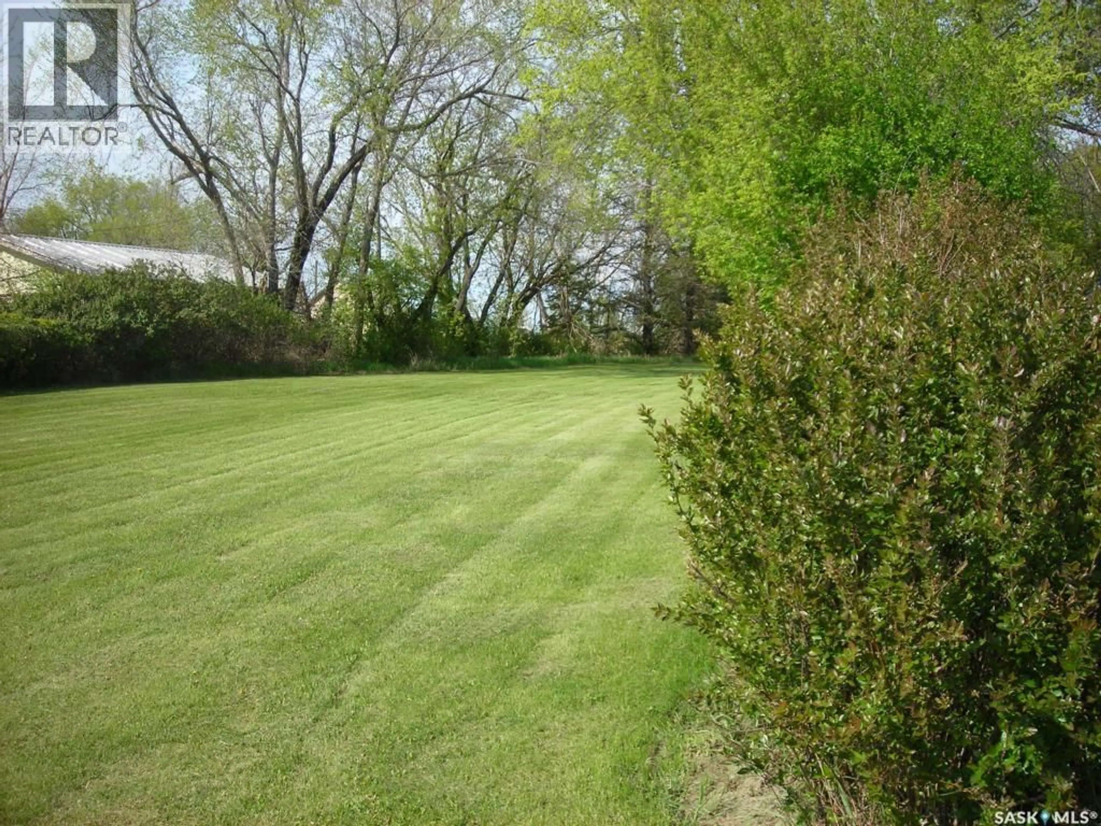 A pic from outside/outdoor area/front of a property/back of a property/a pic from drone, forest/trees view for 69 RAILWAY AVENUE, Calder Saskatchewan S0A4C0