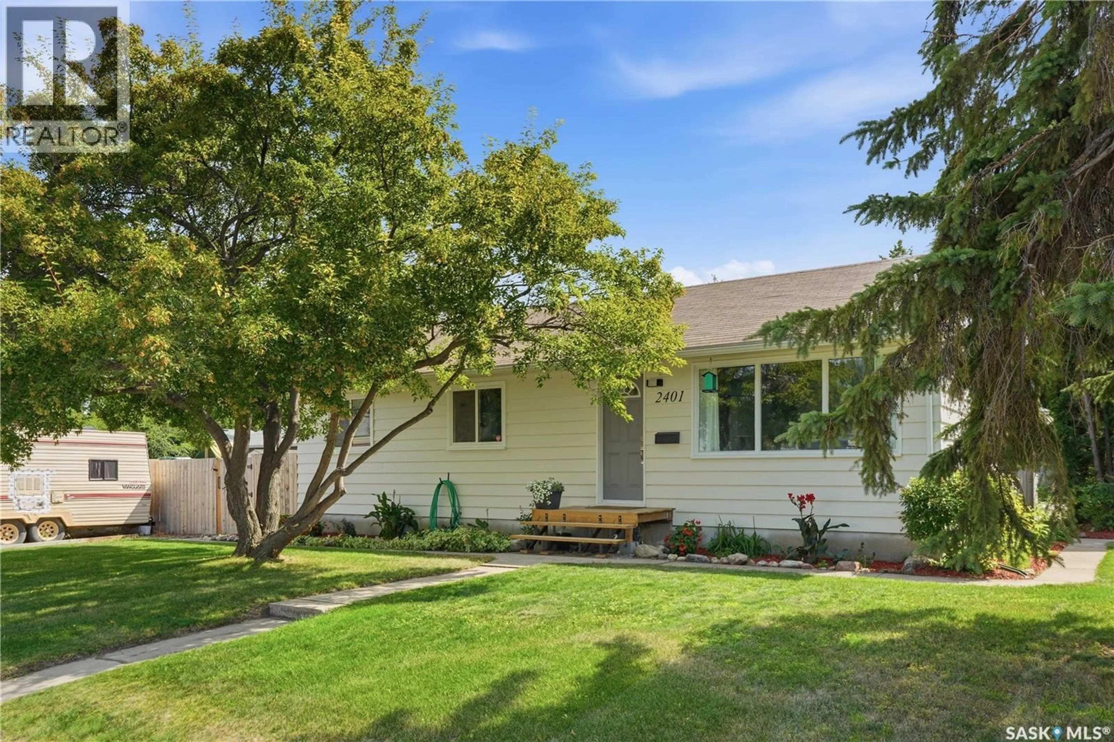 Home with vinyl exterior material, street for 2401 DUFFERIN AVENUE, Saskatoon Saskatchewan S7J1C3
