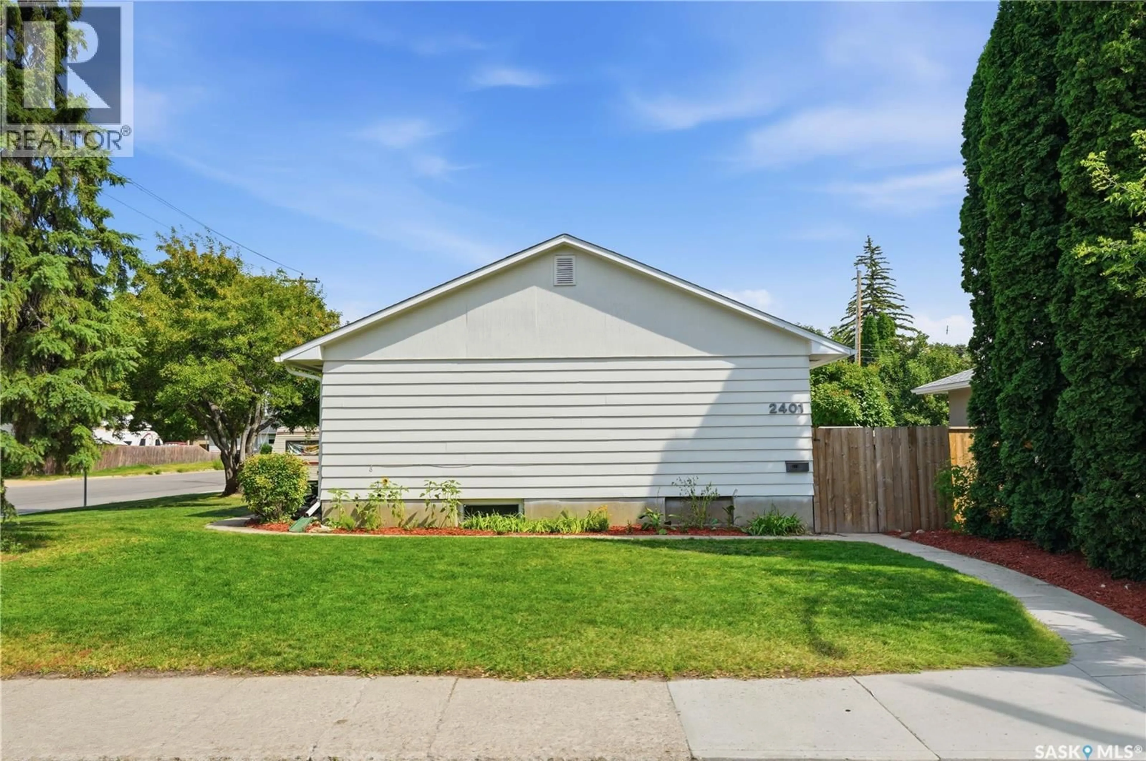 Home with vinyl exterior material, street for 2401 DUFFERIN AVENUE, Saskatoon Saskatchewan S7J1C3