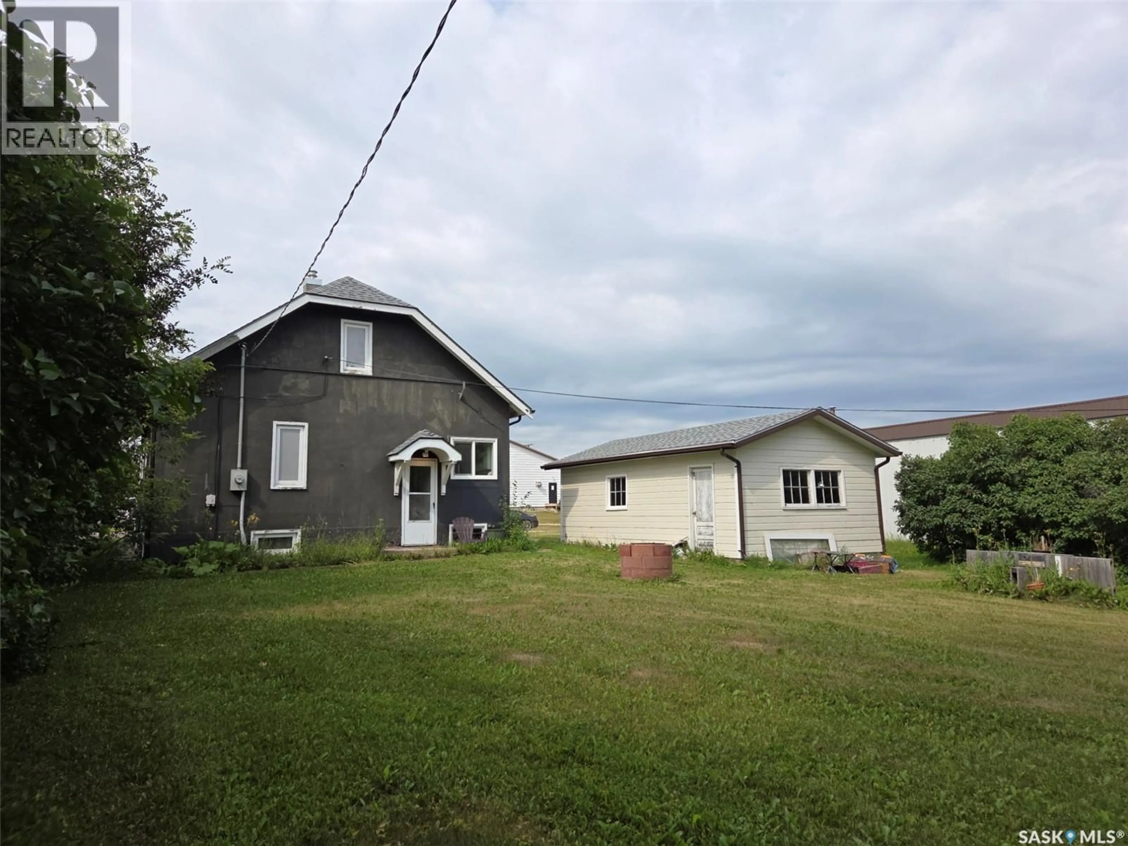 A pic from outside/outdoor area/front of a property/back of a property/a pic from drone, building for S - 203 1ST STREET, Middle Lake Saskatchewan S0K2X0