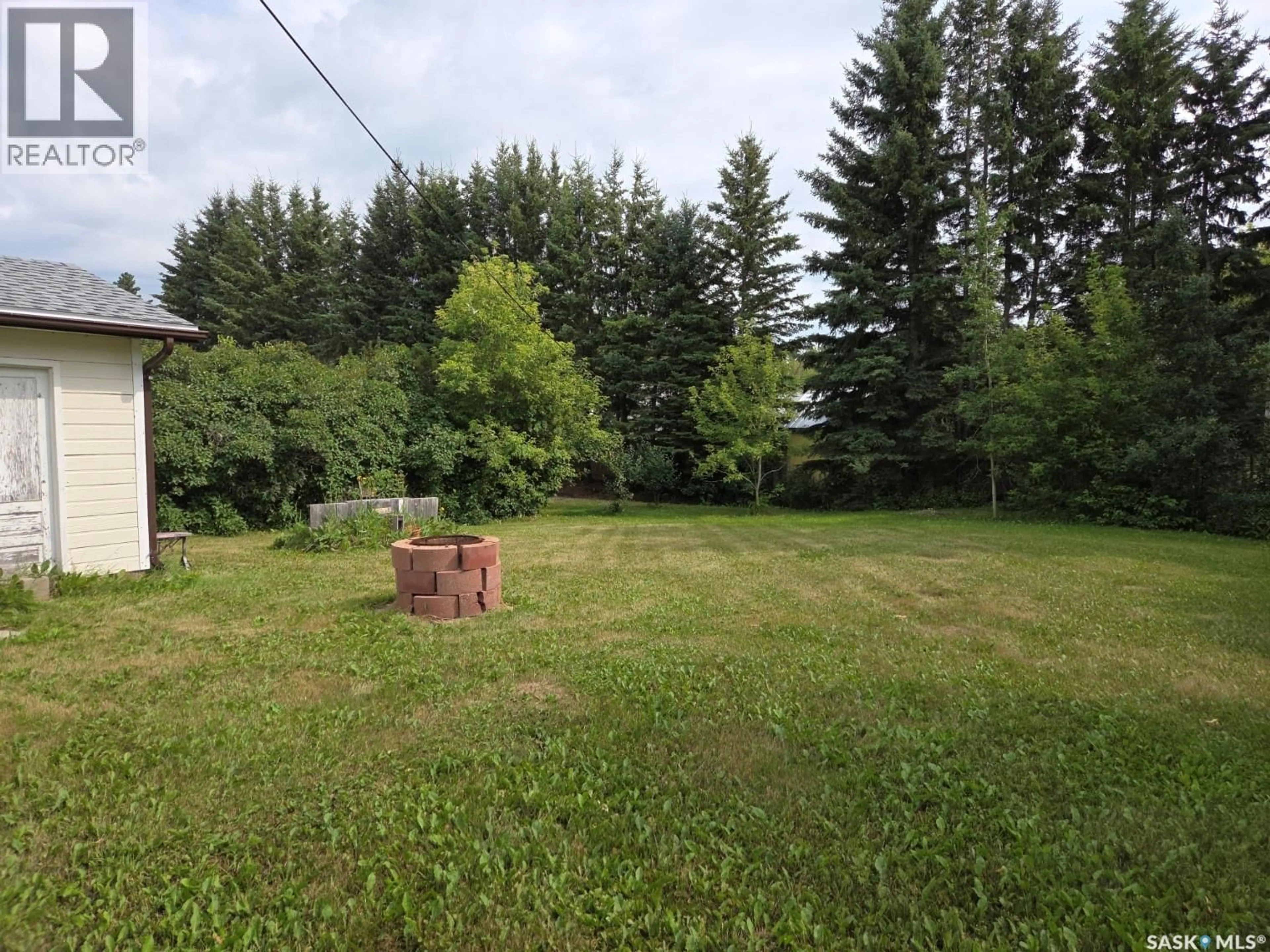 A pic from outside/outdoor area/front of a property/back of a property/a pic from drone, forest/trees view for S - 203 1ST STREET, Middle Lake Saskatchewan S0K2X0