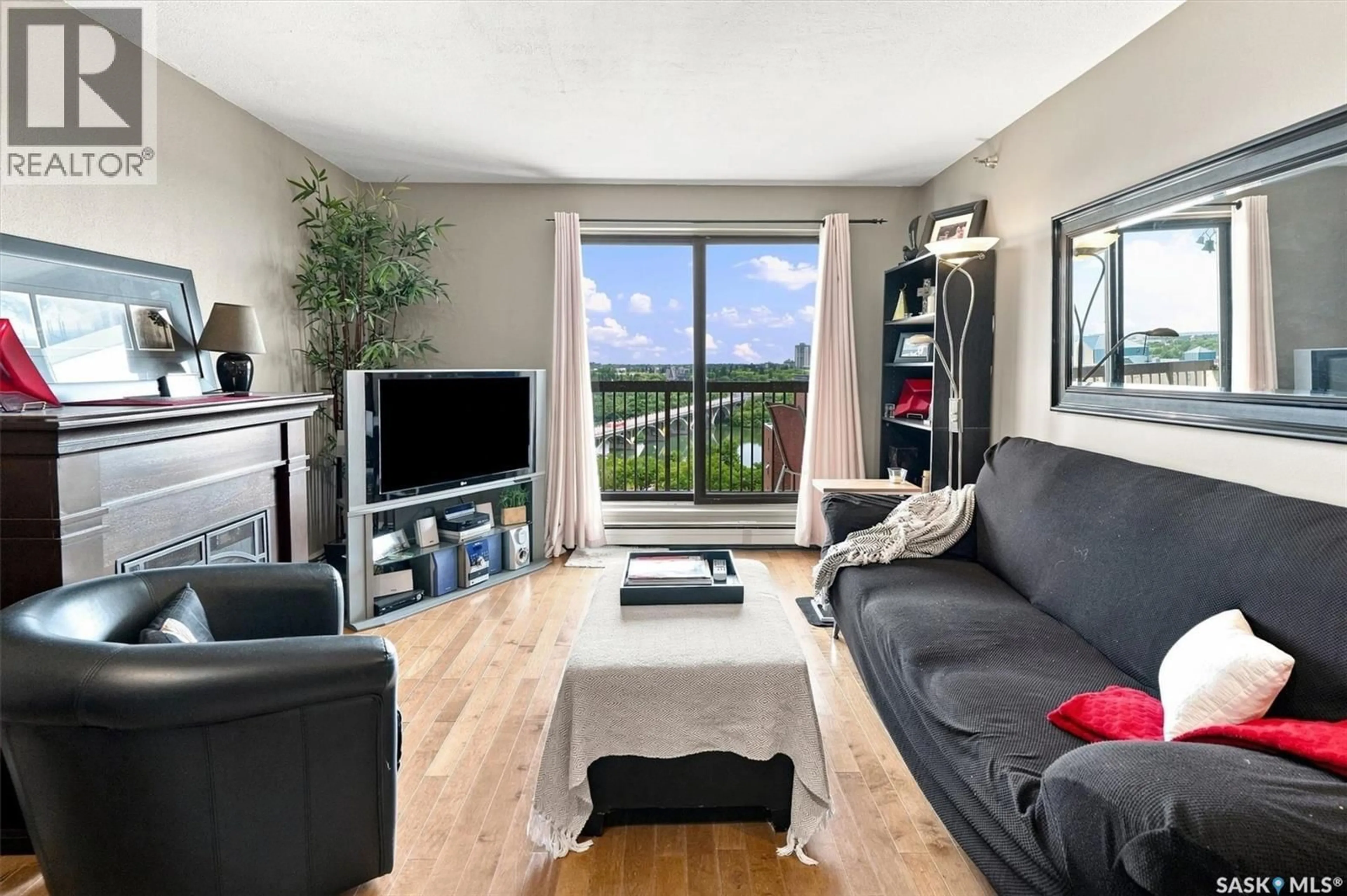 Living room with furniture, wood/laminate floor for 1804 311 6TH AVENUE, Saskatoon Saskatchewan S7K7A9