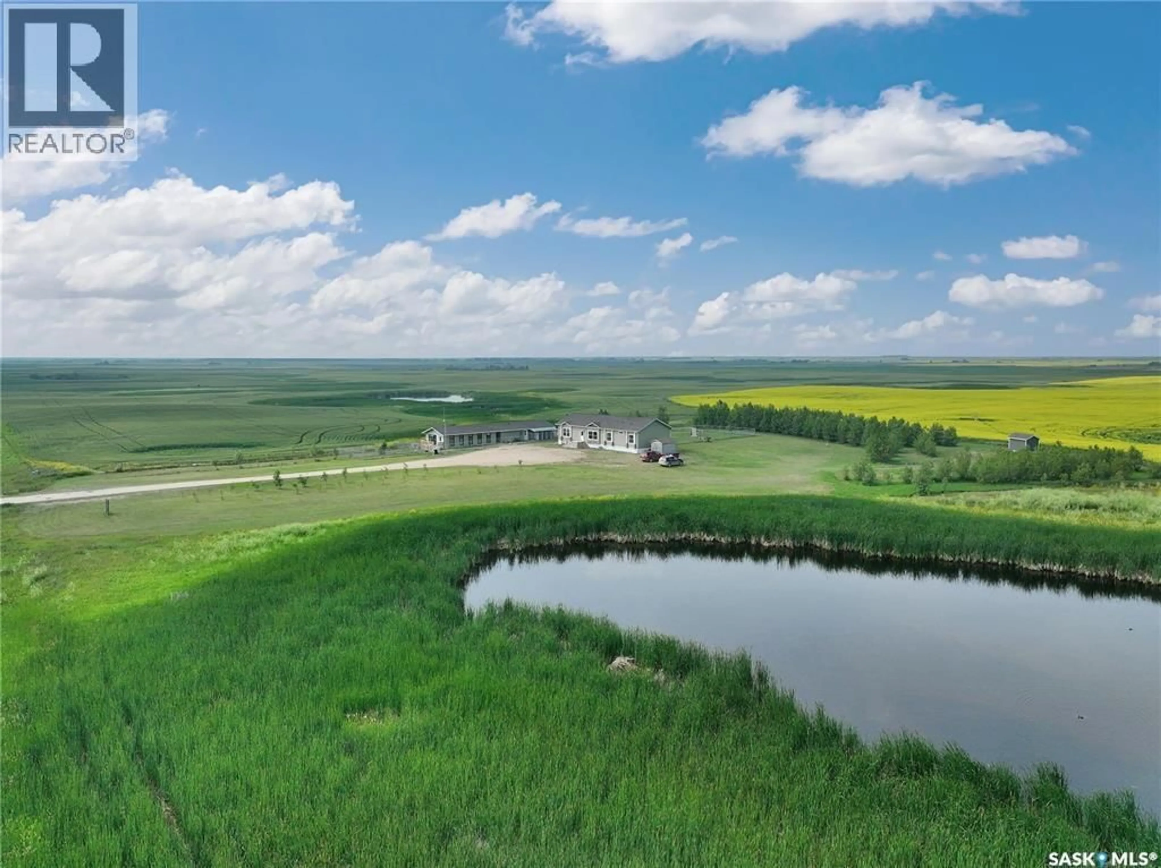 A pic from outside/outdoor area/front of a property/back of a property/a pic from drone, water/lake/river/ocean view for ENVY DOG HOUSE ACREAGE, Silverwood Rm No. 123 Saskatchewan S0G4Z0