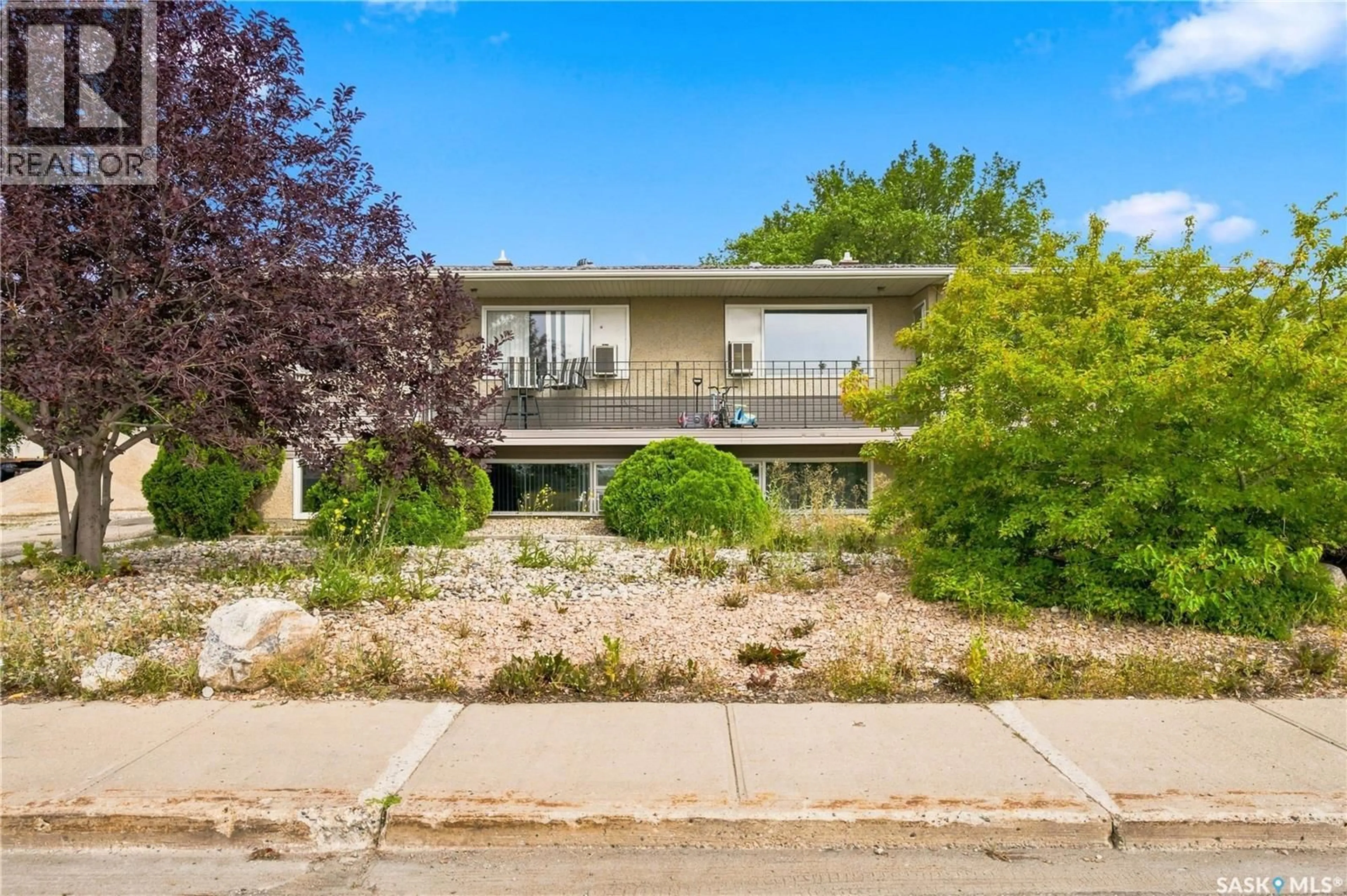 Home with brick exterior material, street for 7110-7112 DEWDNEY AVENUE, Regina Saskatchewan S4T1E6