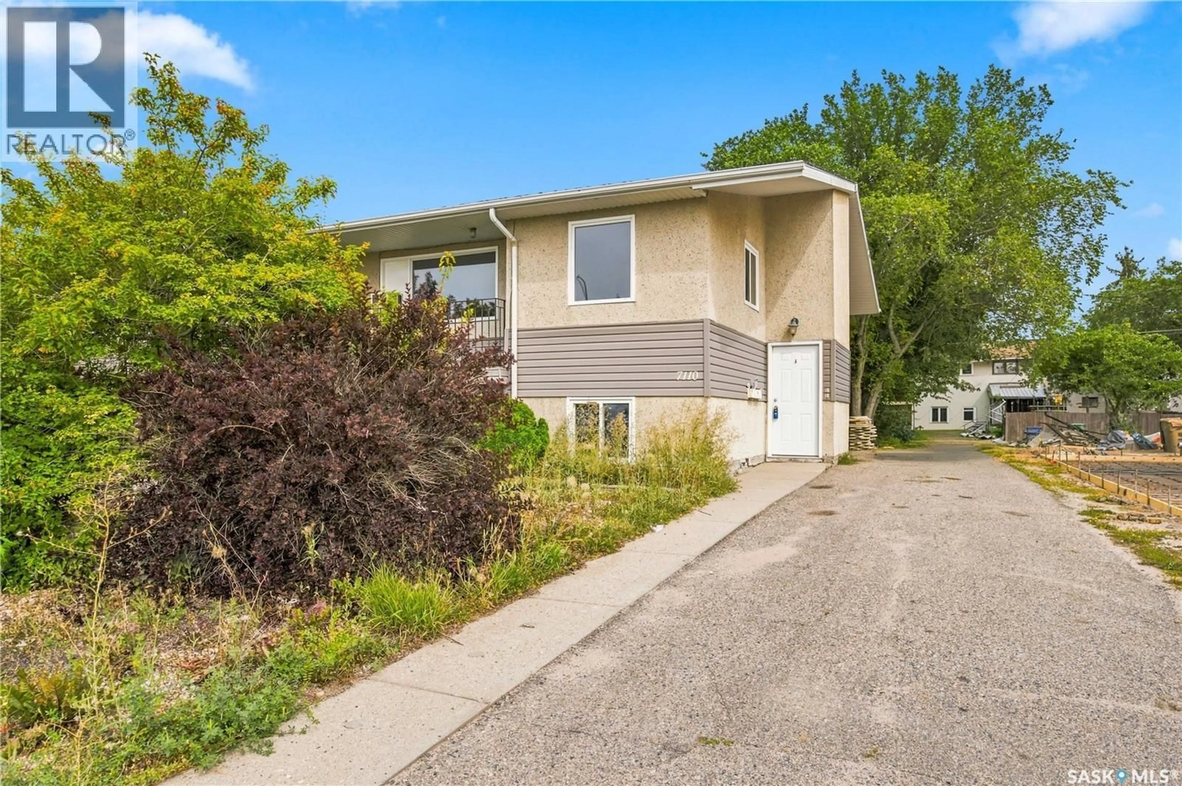 Home with vinyl exterior material, street for 7110-7112 DEWDNEY AVENUE, Regina Saskatchewan S4T1E6