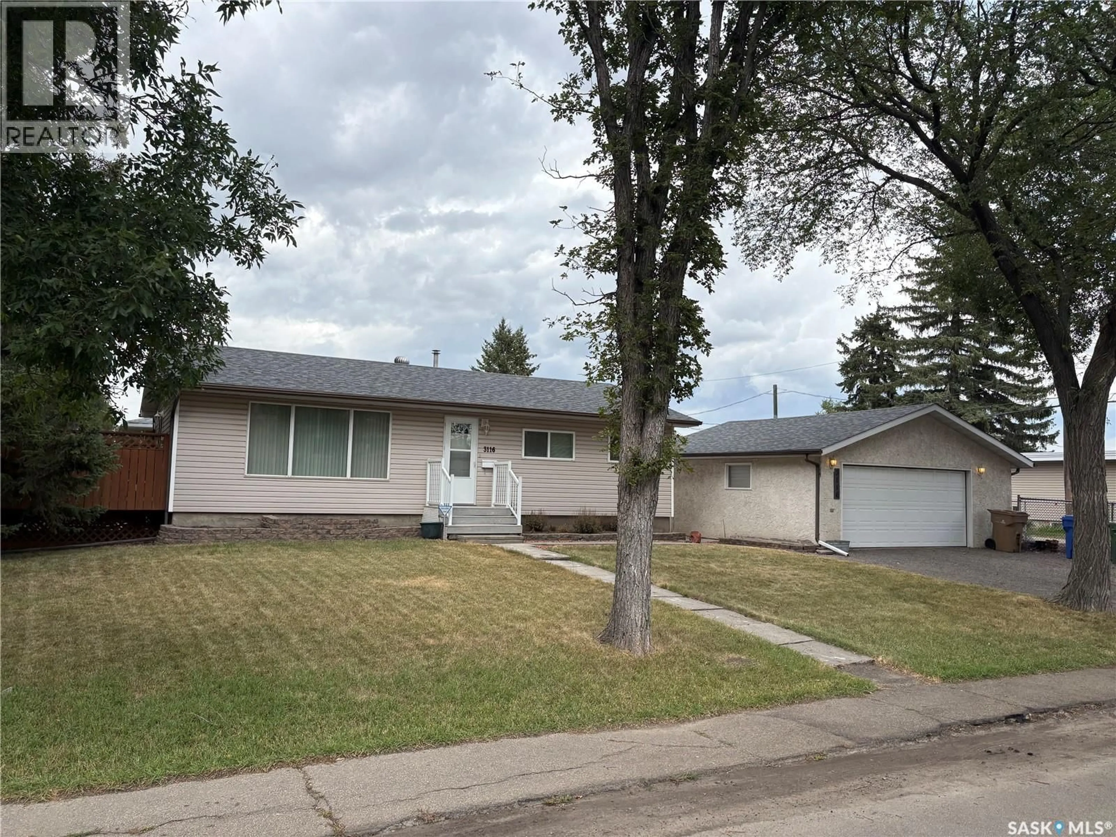 Home with vinyl exterior material, street for 3116 3RD AVENUE, Regina Saskatchewan S4R0W6