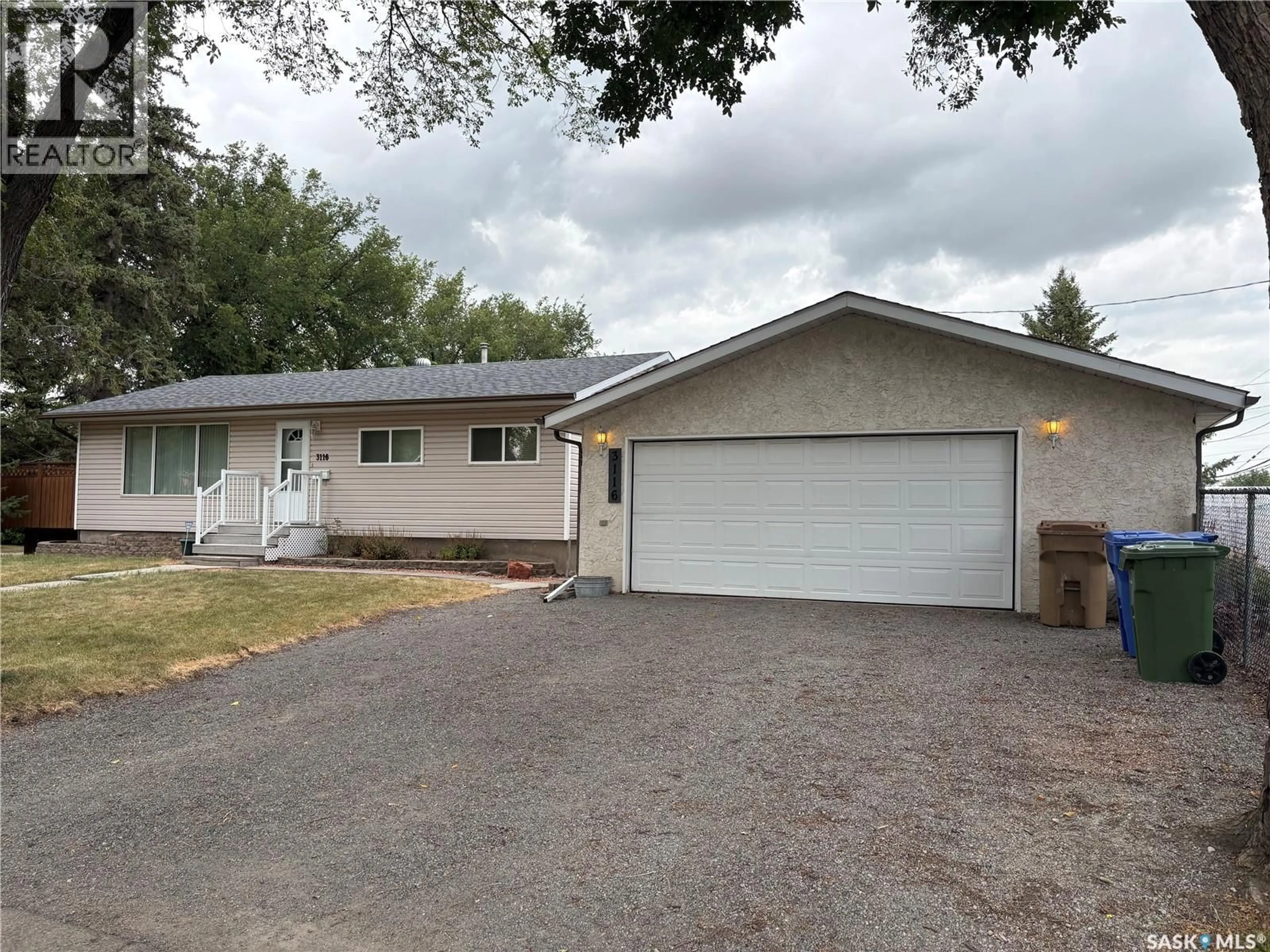 Home with vinyl exterior material, street for 3116 3RD AVENUE, Regina Saskatchewan S4R0W6
