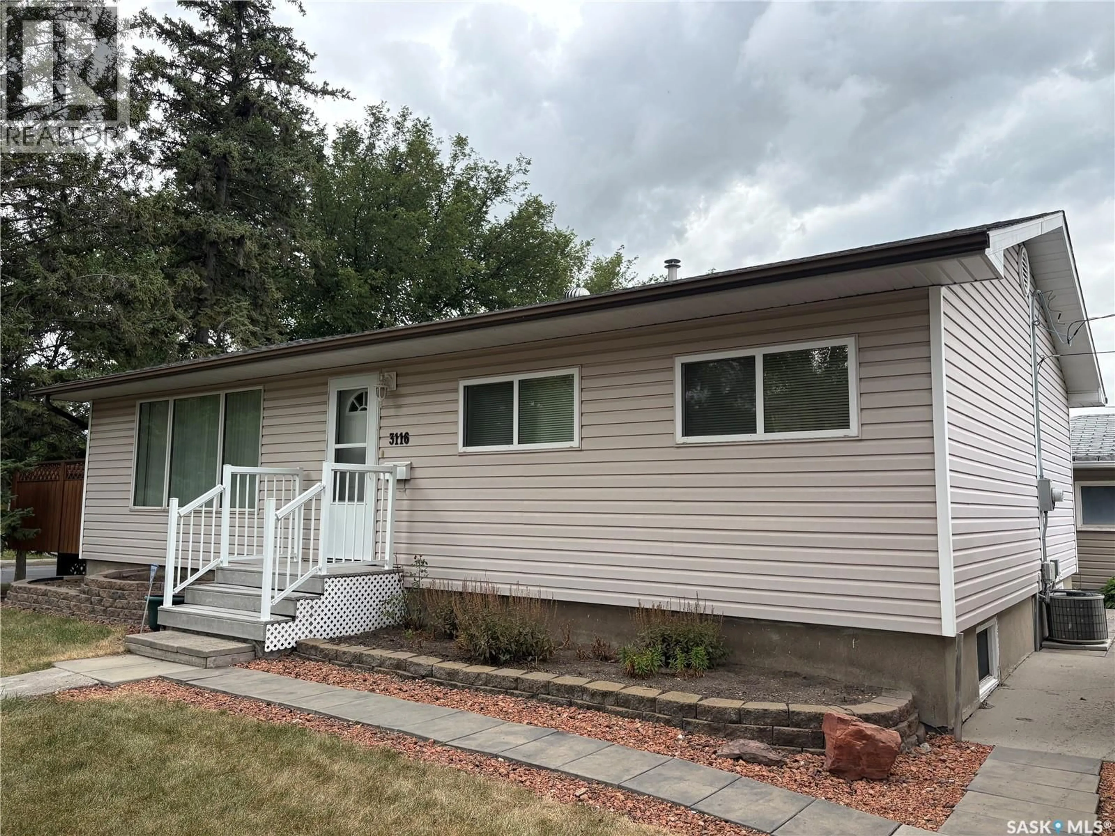 Home with vinyl exterior material, street for 3116 3RD AVENUE, Regina Saskatchewan S4R0W6