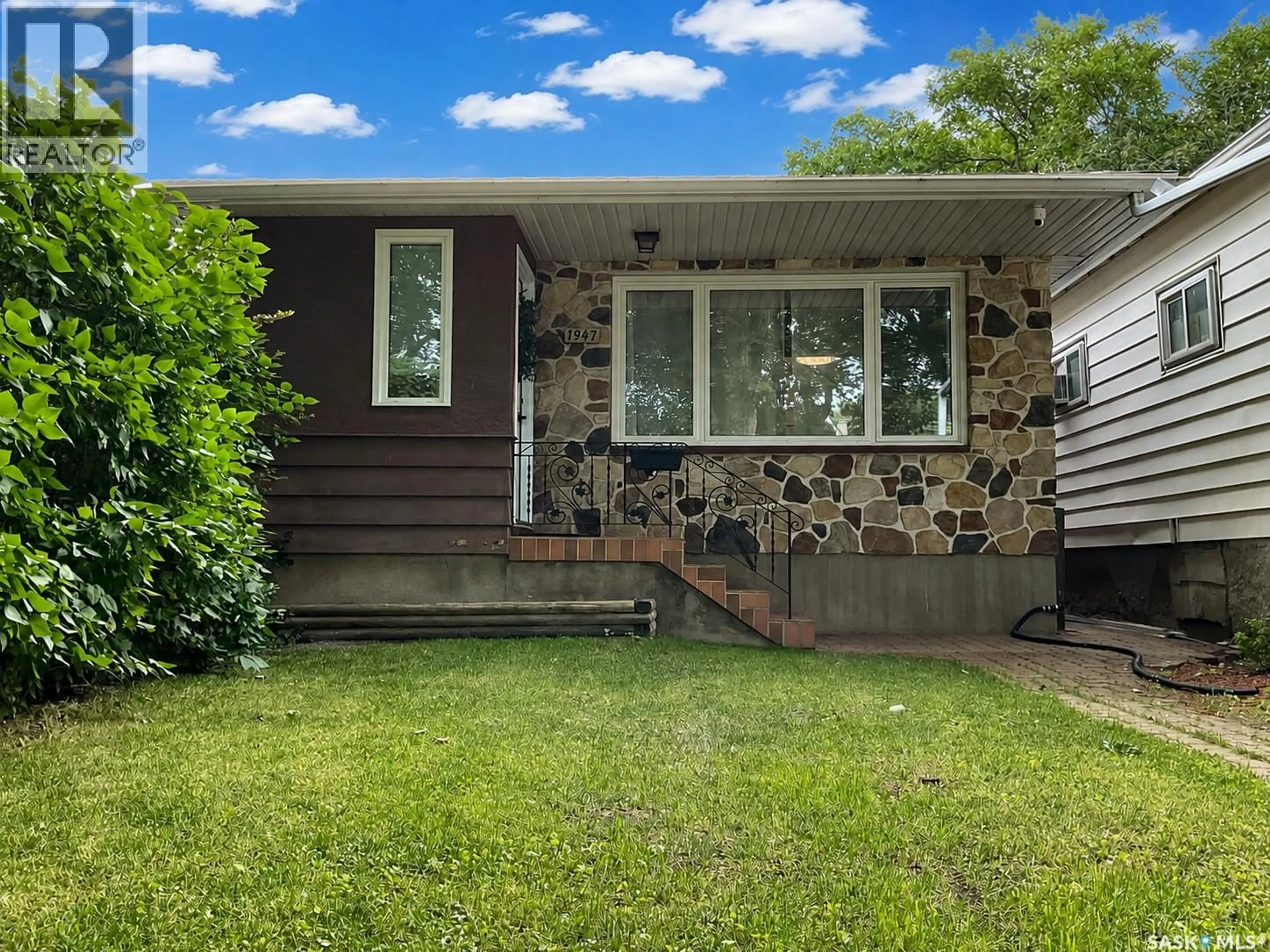 Home with vinyl exterior material, street for 1947 ATHOL STREET, Regina Saskatchewan S4T3E4