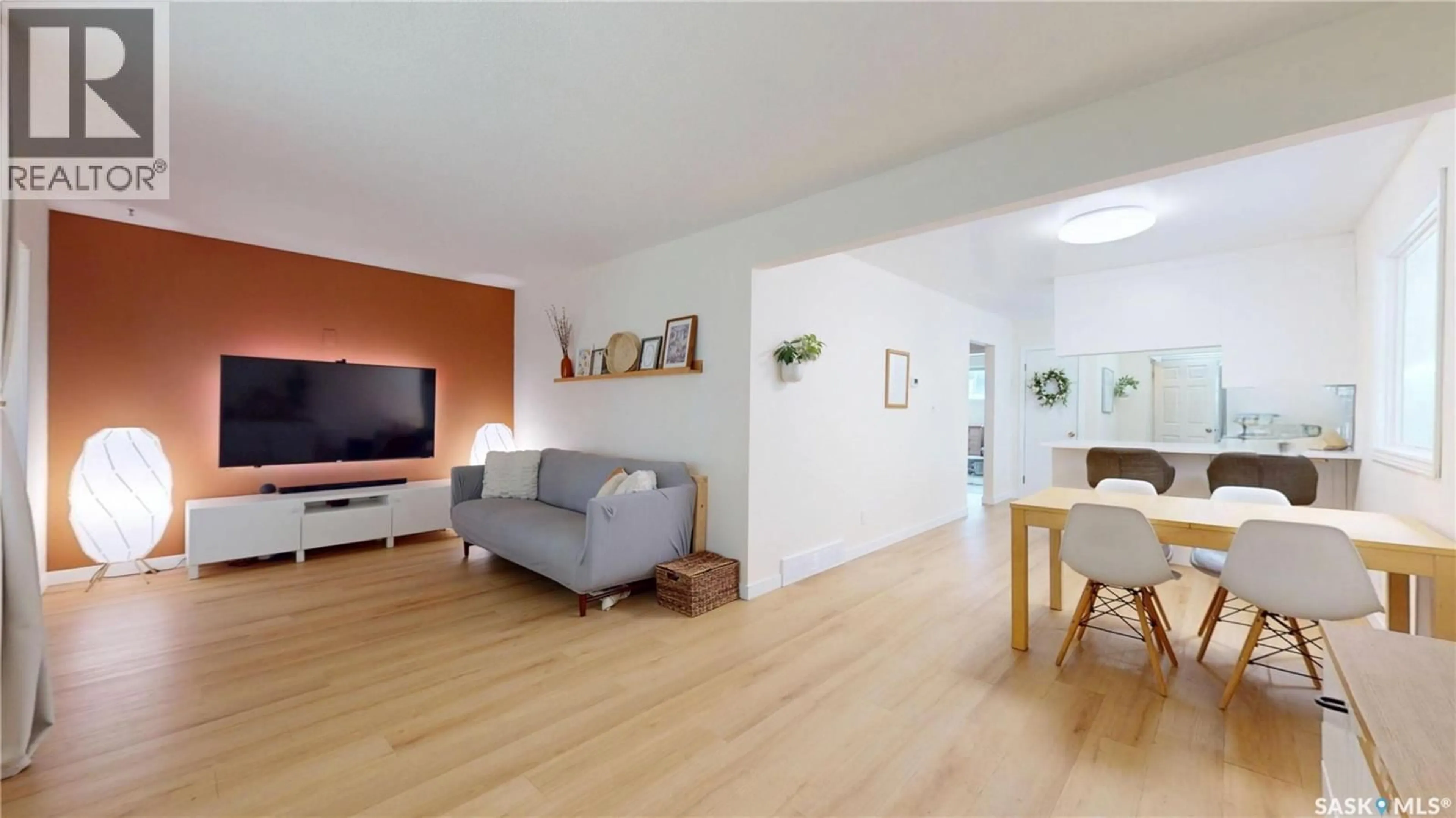 Living room with furniture, wood/laminate floor for 1947 ATHOL STREET, Regina Saskatchewan S4T3E4