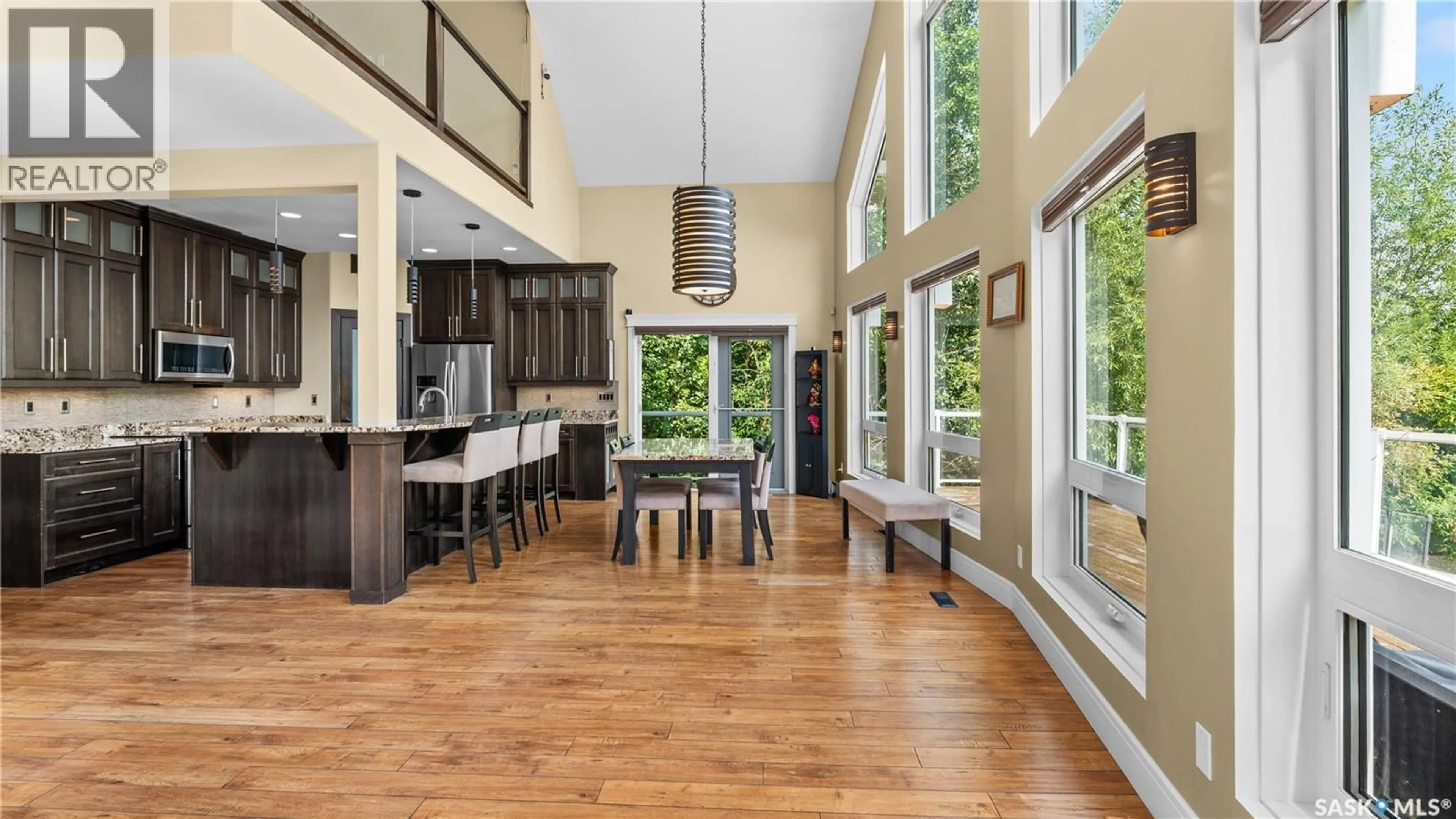 Open concept kitchen, wood/laminate floor for 19 ROSE CRESCENT, Pike Lake Provincial Park Saskatchewan S7T1A1