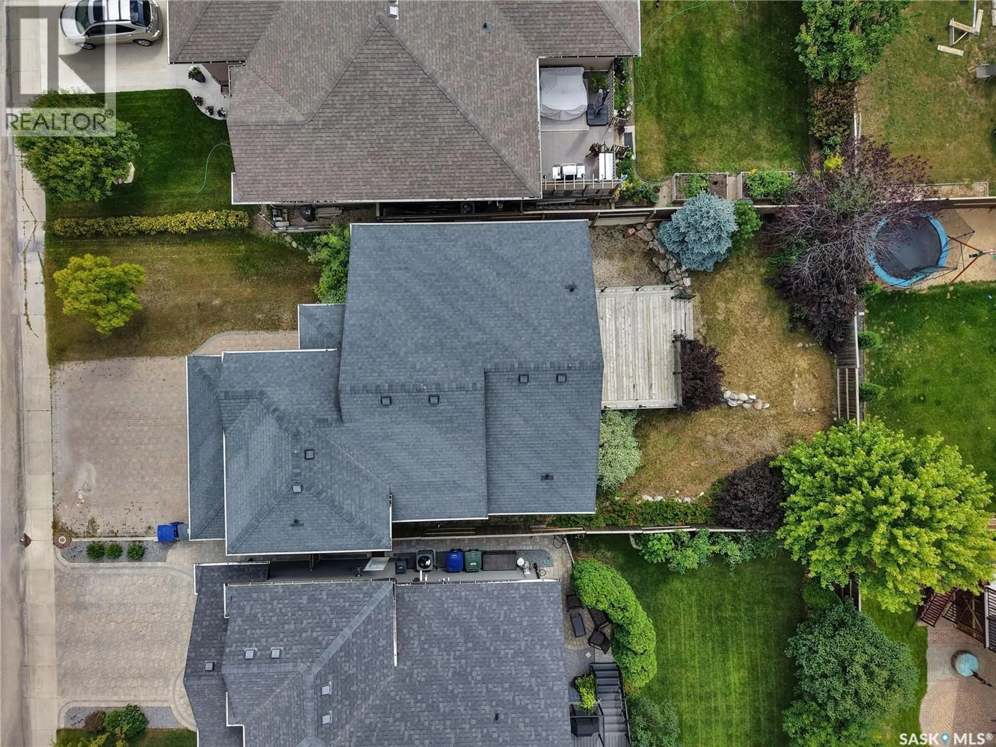 A pic from outside/outdoor area/front of a property/back of a property/a pic from drone, street for 1103 MUZYKA ROAD, Saskatoon Saskatchewan S7W0E7