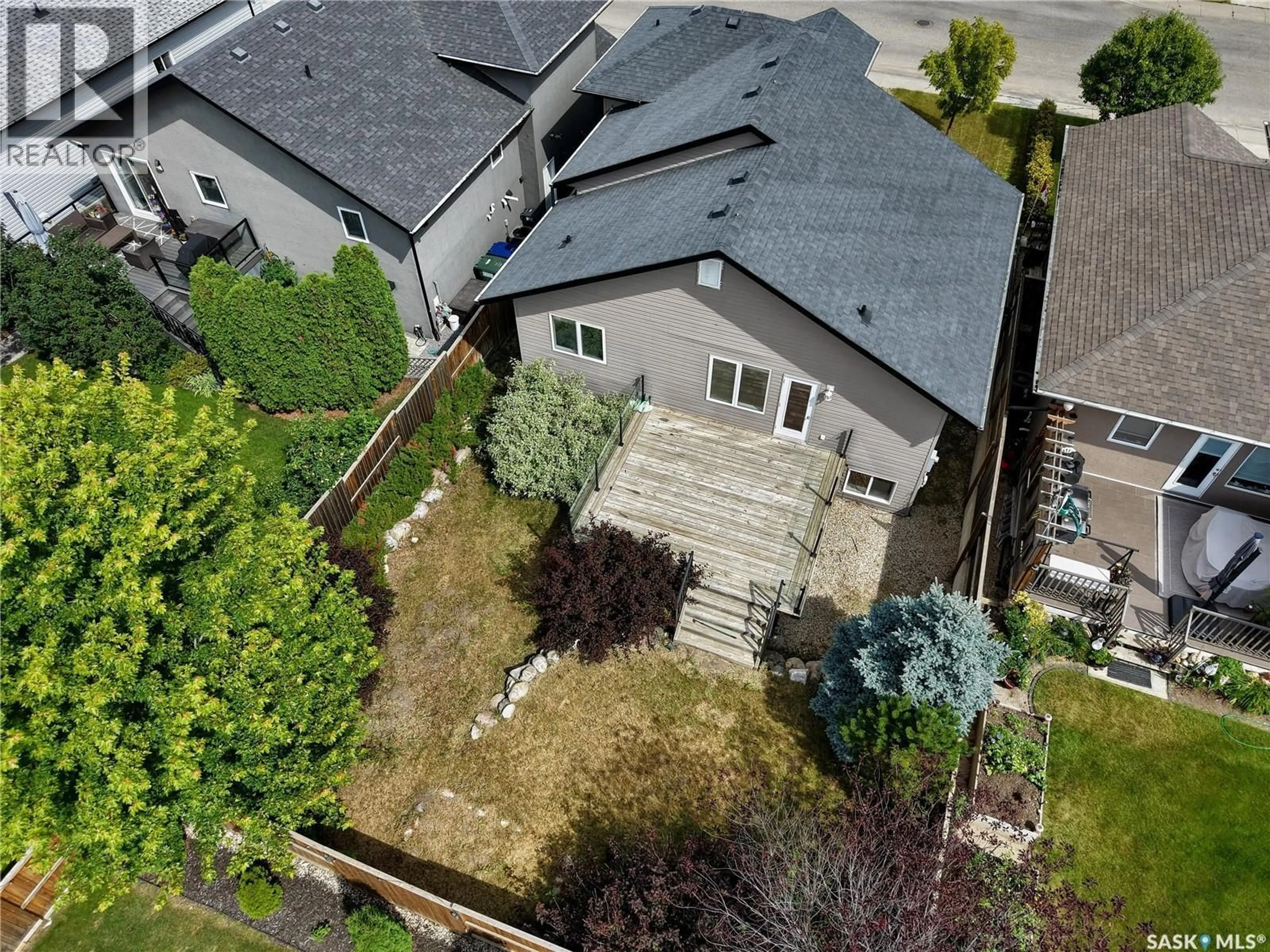 A pic from outside/outdoor area/front of a property/back of a property/a pic from drone, street for 1103 MUZYKA ROAD, Saskatoon Saskatchewan S7W0E7